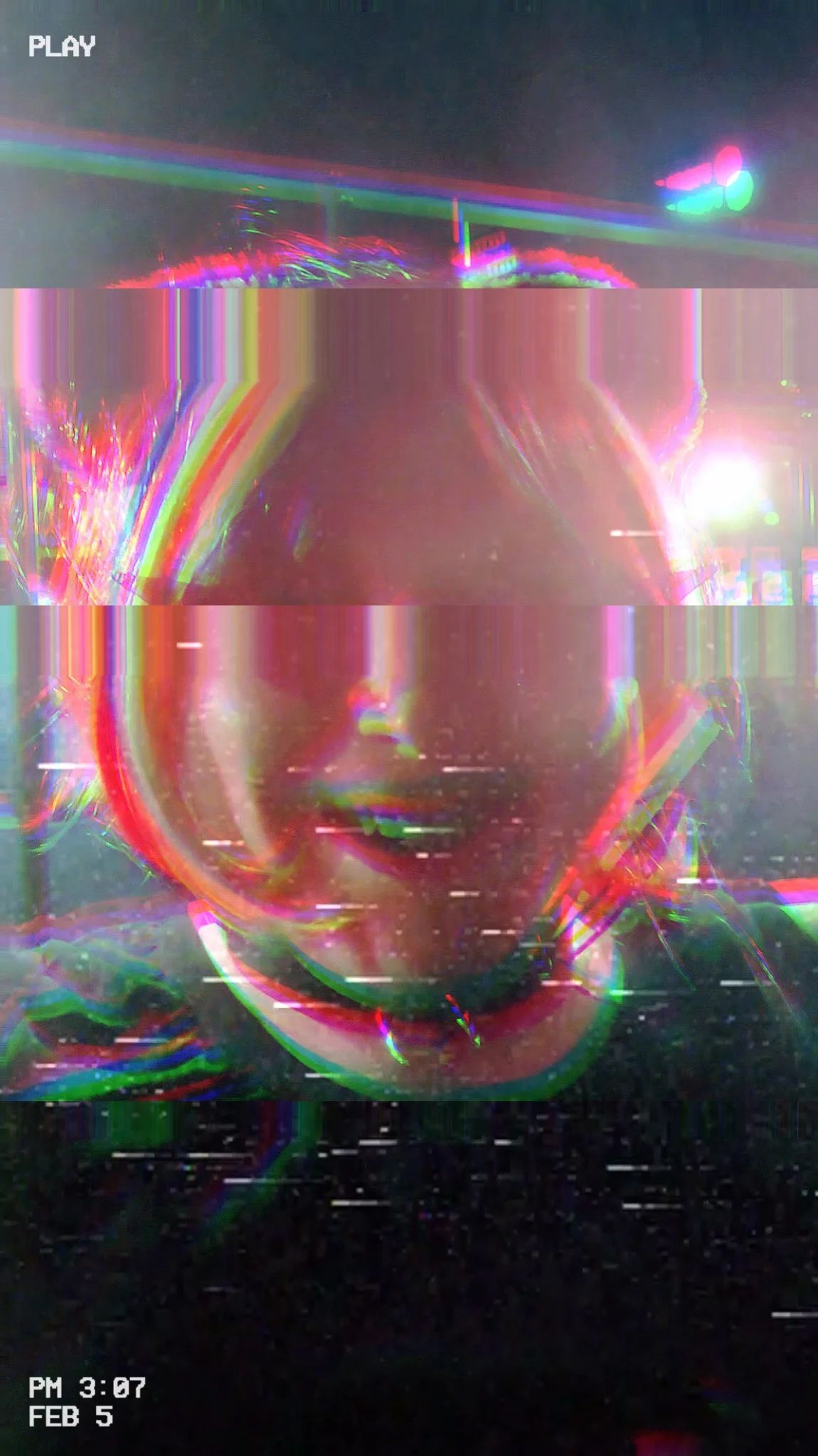 smiling cat person uner heavy vhs static and tape rolling filter