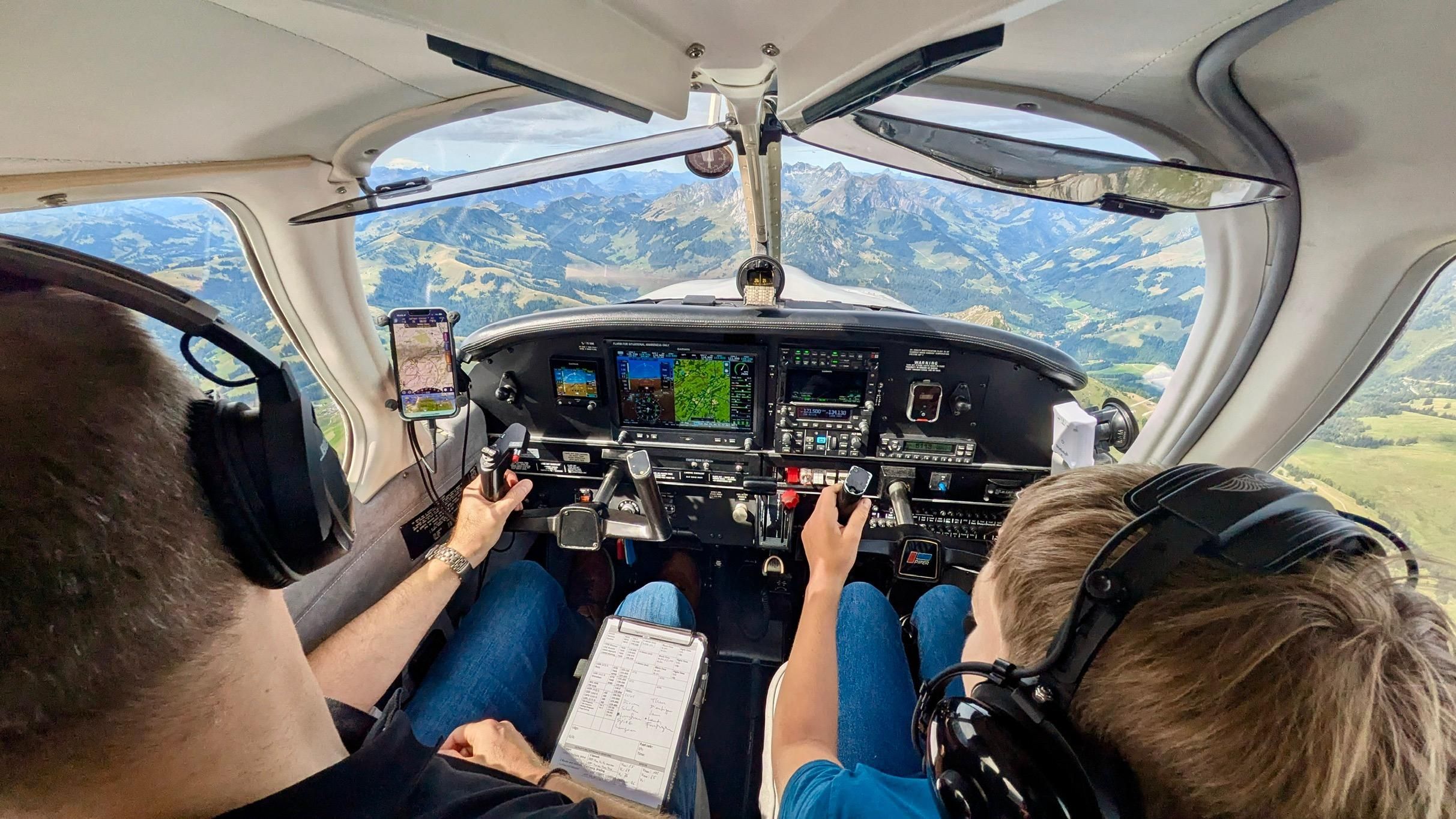My godchild and me sitting in the Piper Archer (up in the air).