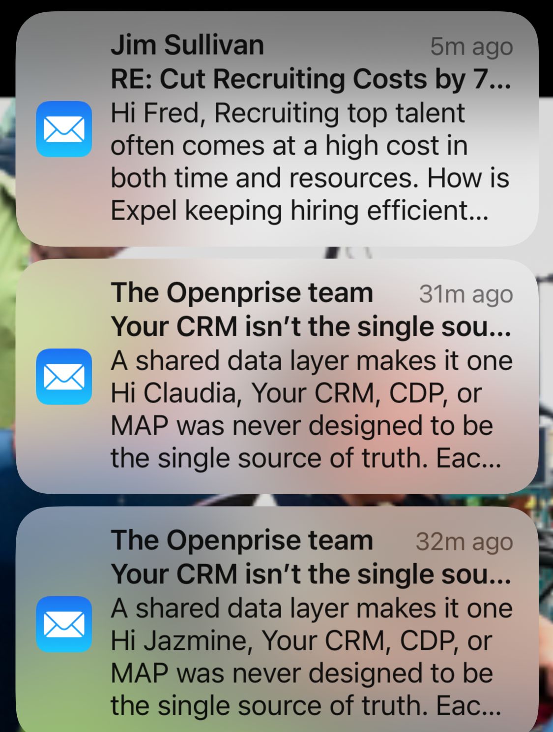 Example of unending cold-email spam I get addressed to non-existent people on my home domain. Three email previews on iPhone Lock Screen. 