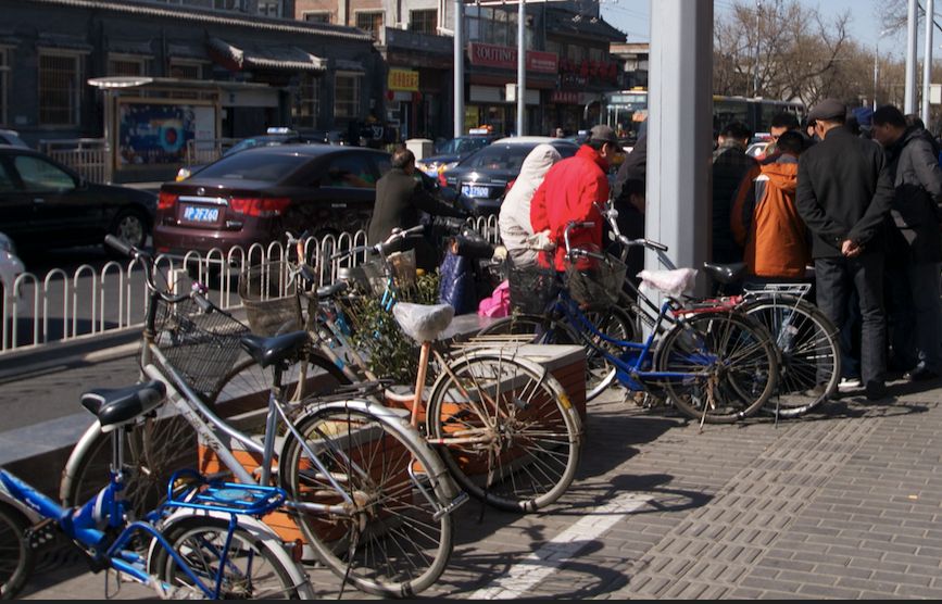 many bikes locked up at an intersection