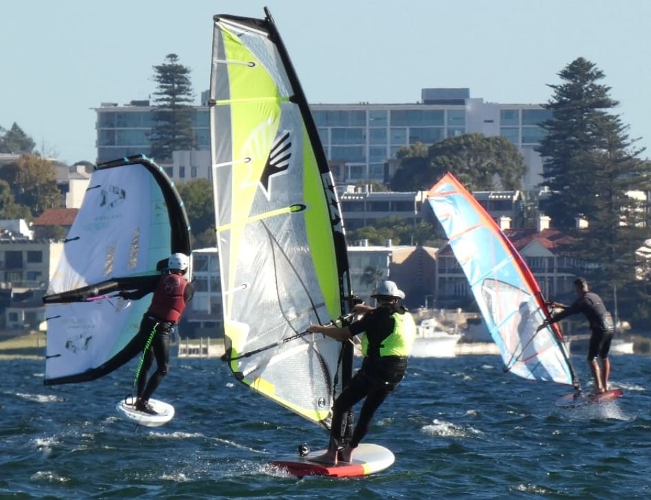 Wind foiler found away with other wing foiler and wind foiler in back ground.