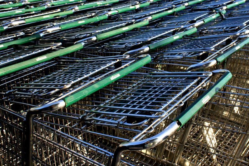 Grocery carts with green handles at the Whole Foods store