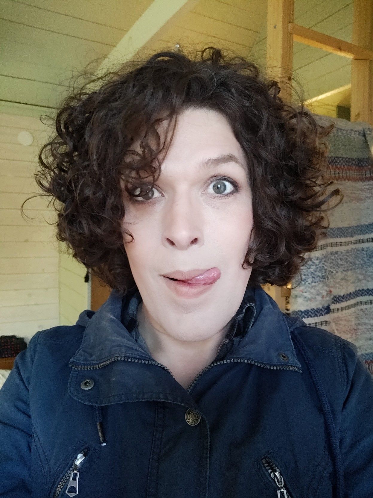 me in a blue jacket with my eyes wide open and licking my upper lip