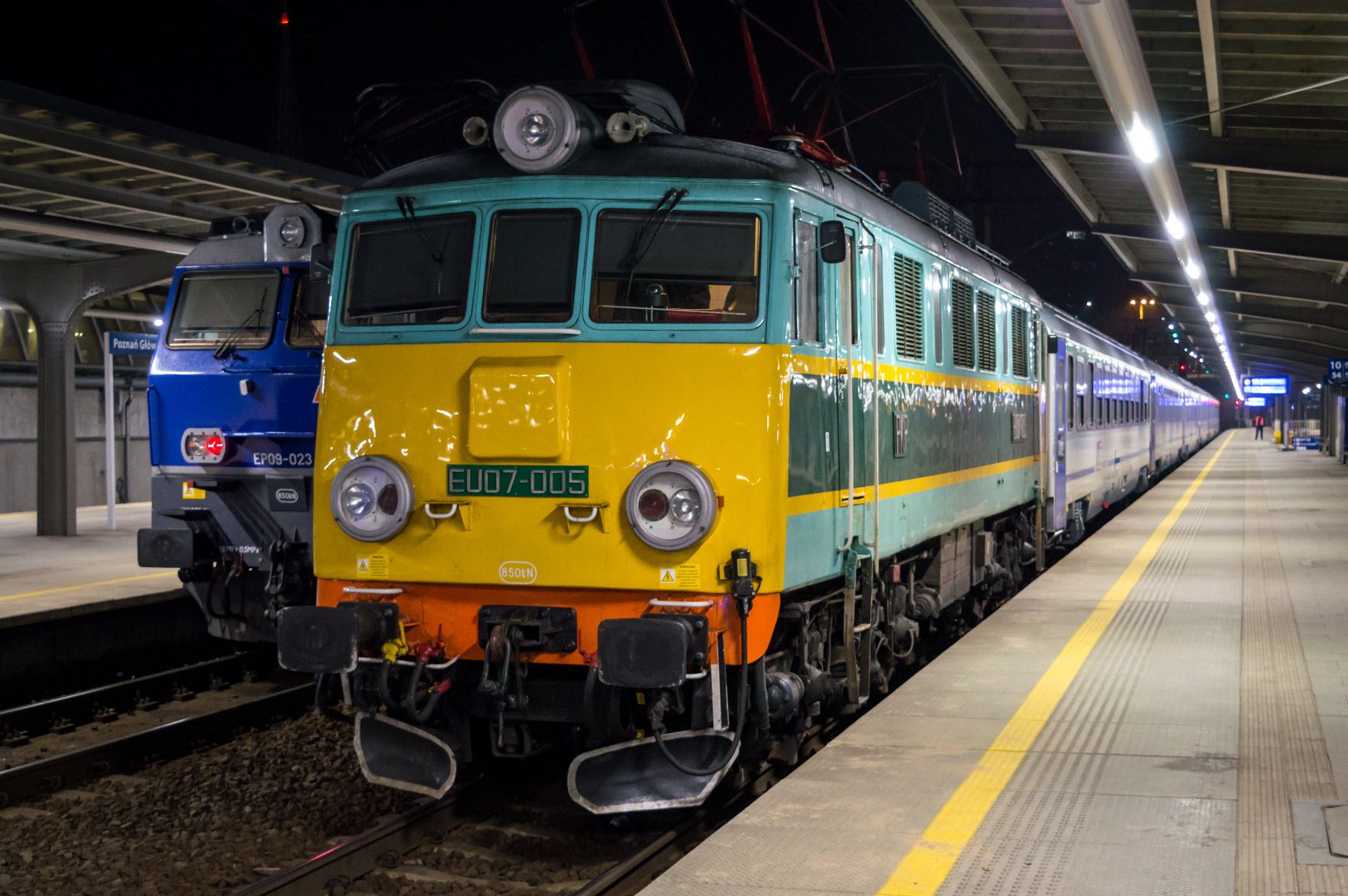 EU07 locomotive of PKPIC in historical yellow and green livery at Poznań Główny