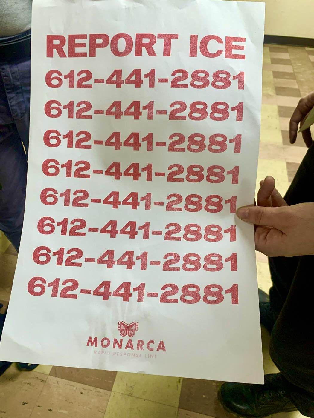 A flier reading "Report ICE" with the phone number 612-441-2881