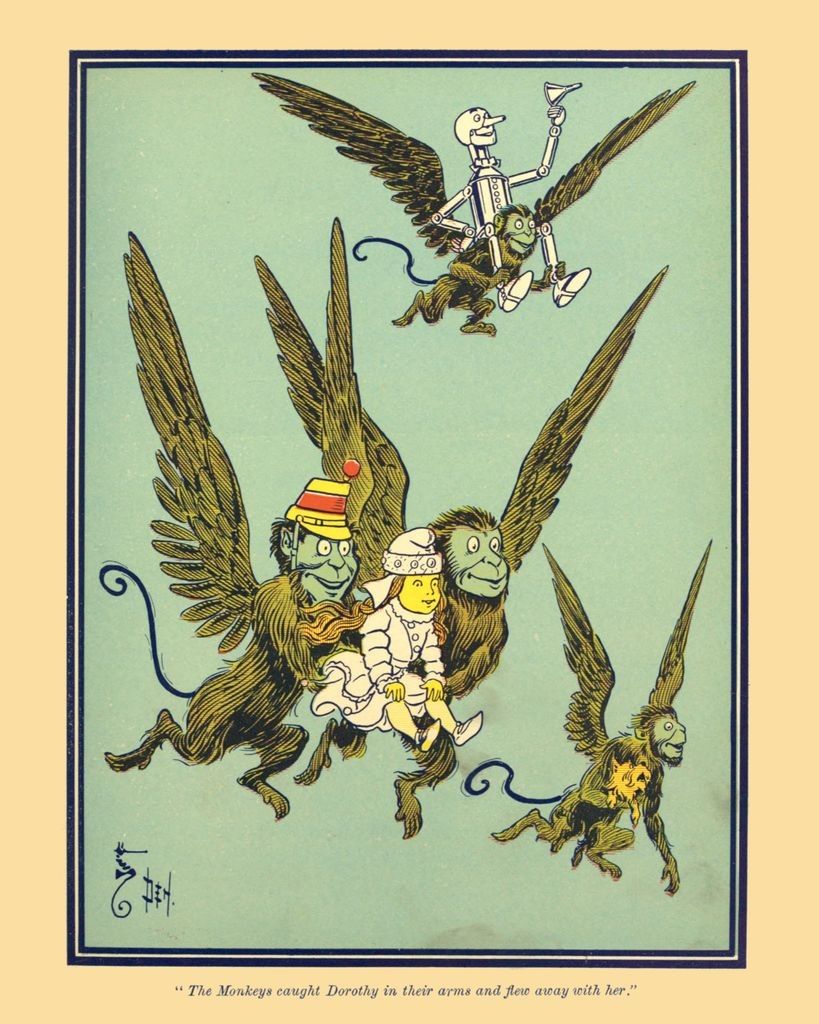 A W.W. Desnlow illustration from the original The Wonderful Wizard of Oz book. It depicts the Winged Monkeys in flight, one bearing the Ton Woodman, one carrying Toto, and two carrying Dorothy, wearing the golden cap that allows its wearer to command Monkeys. The caption reads "The Monkeys caught Dorothy in their arms and flew away with her." 