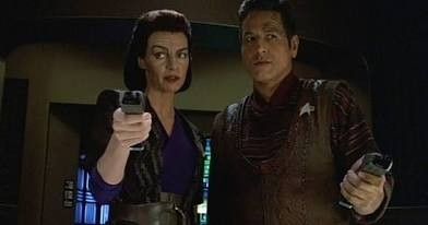 Chakotay and Seska wearing Maquis outfits and holder phasers