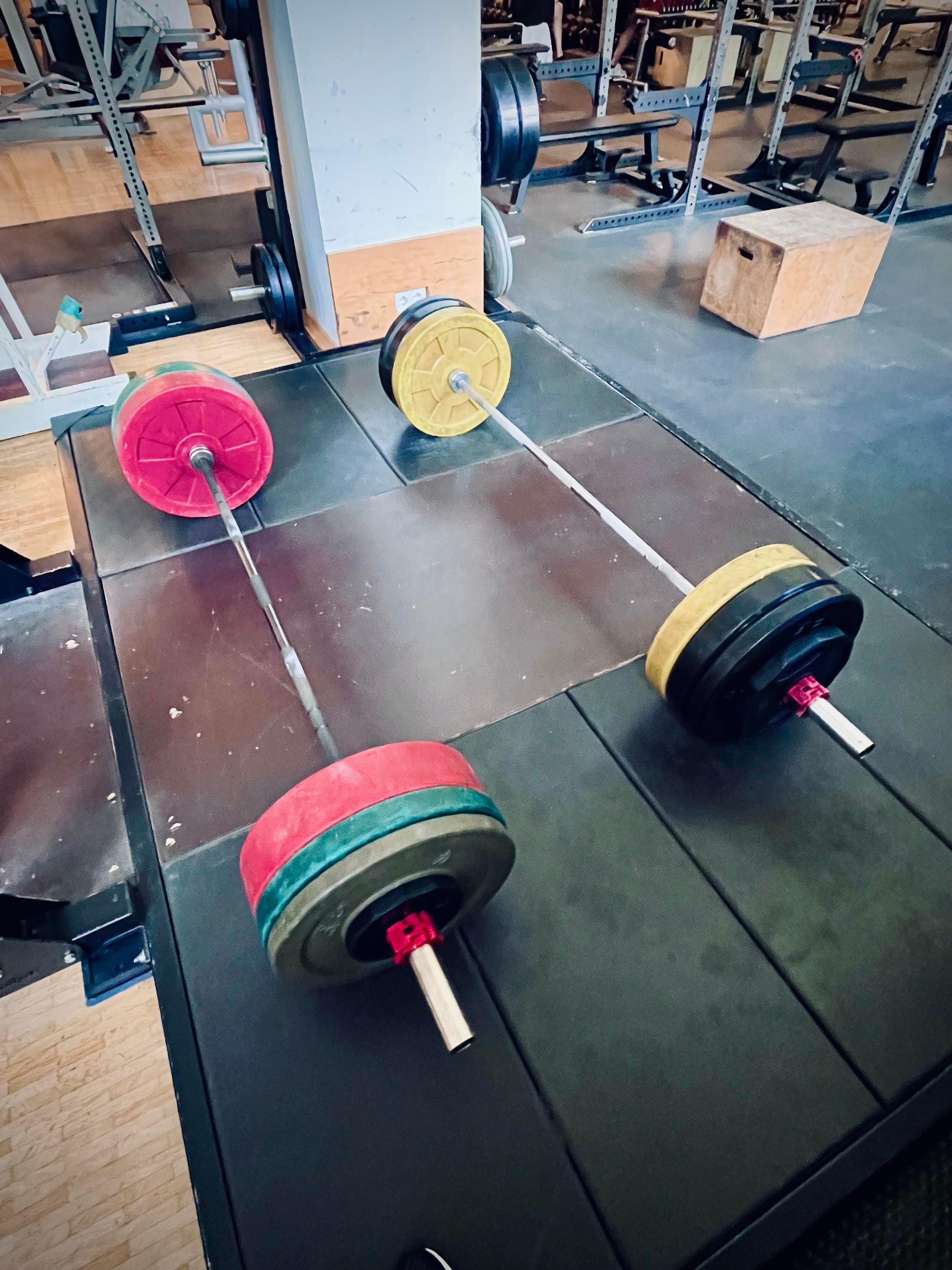 Deadlift platform with two loaded barbells on it