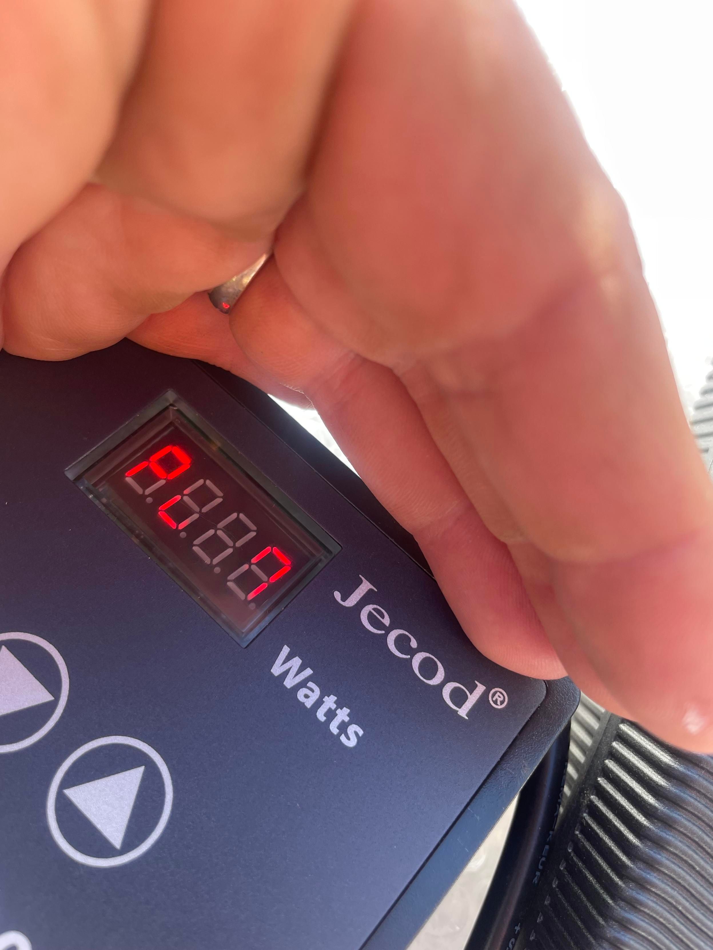 My hand is shading over a small controller box with a display reading P 7 with two numbers missing. There are up and down buttons.