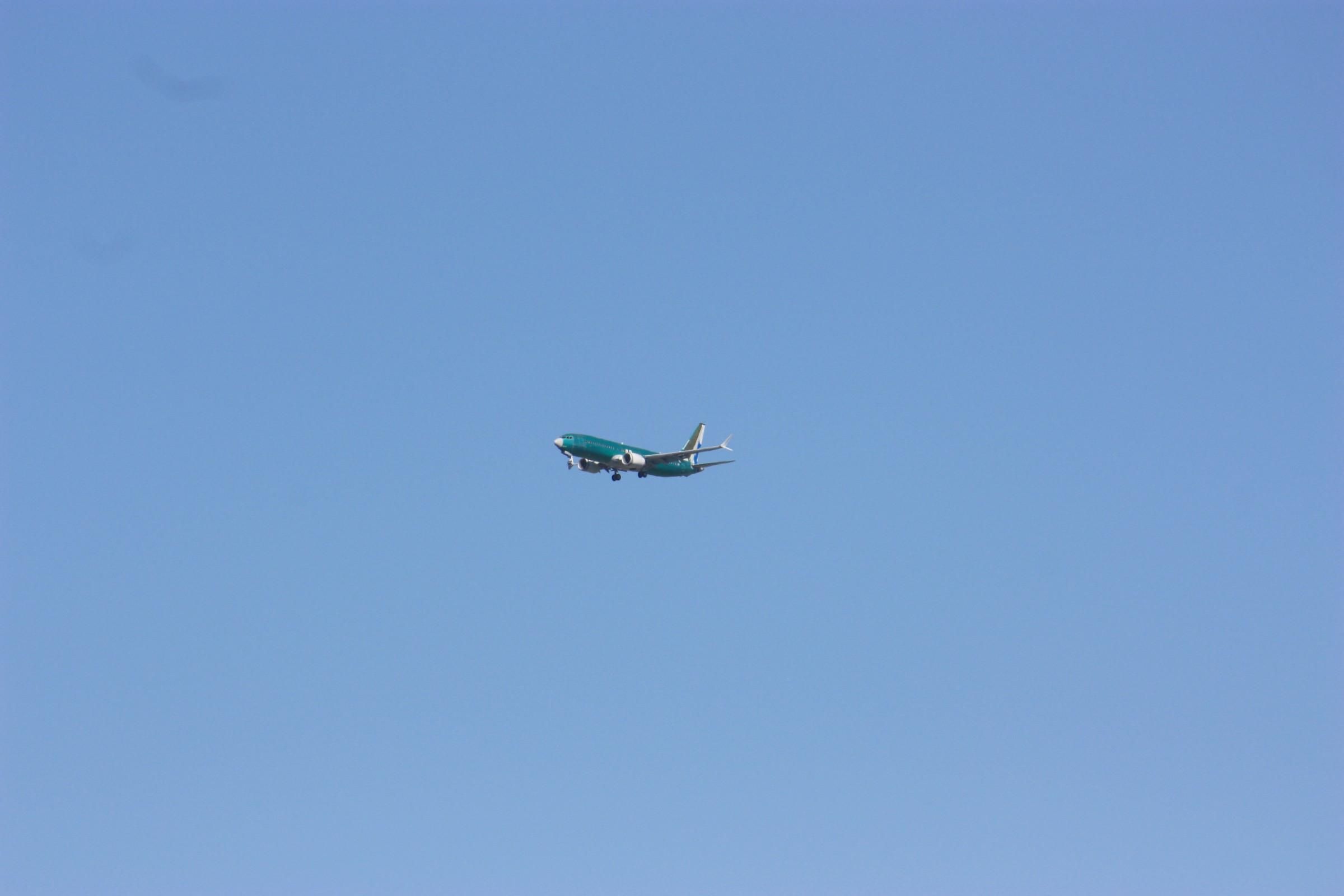 A brand new green unpainted Boeing 737 MAX8 on final approach to Portland Int'l Airport PDX for painting. It flew in from the Boeing 737 factory in Renton, Washington, probably on this plane's first flight. The pre-painted rudder indicates this aircraft will go to SCAT Airlines of Kazakhstan.
photo by Ian Kluft
July 28, 2025
Portland, Oregon, USA