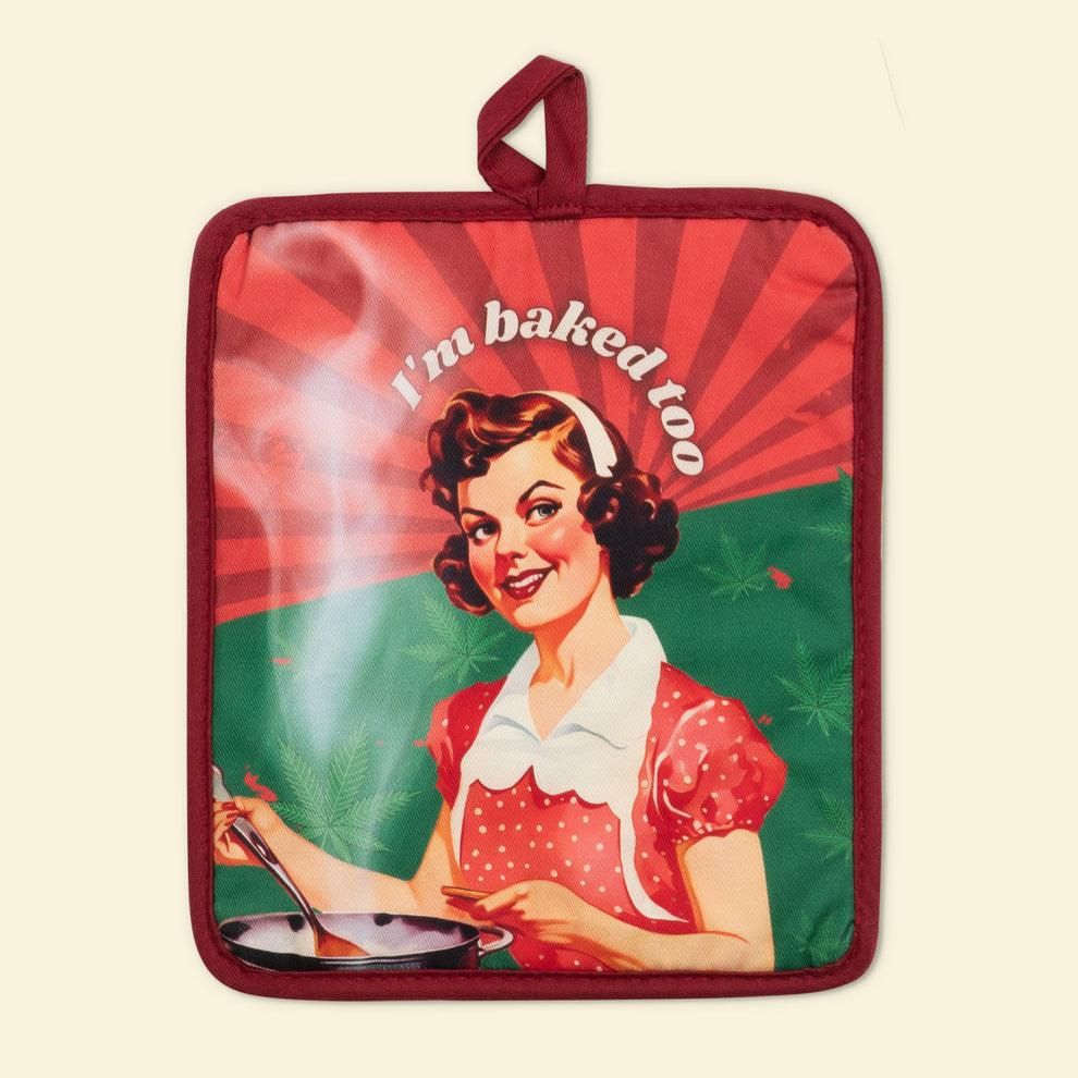 A potholder with a woman cooking on it. It says "I'm baked too".