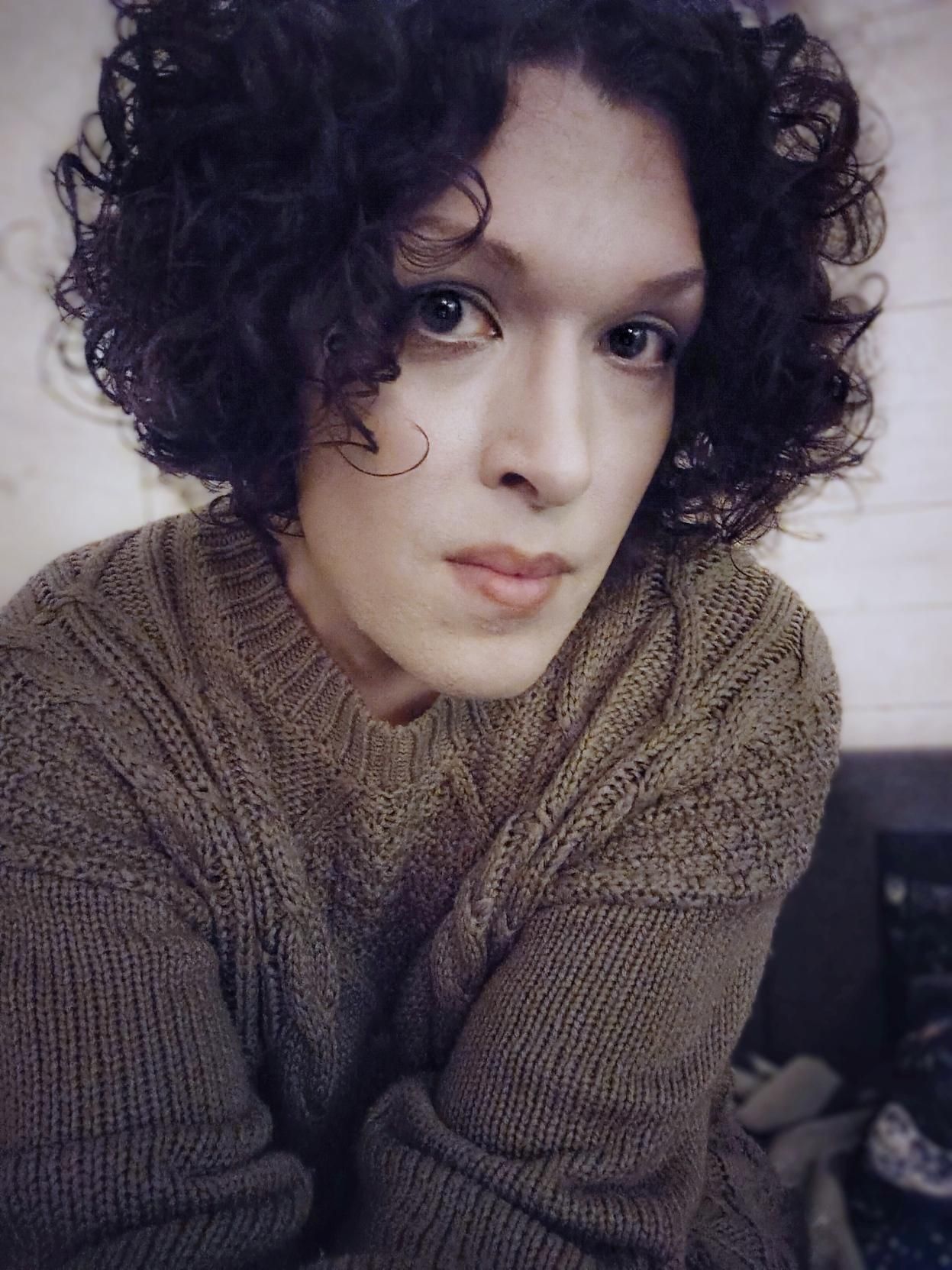 me in a knitted sweater dress, looking a bit weary