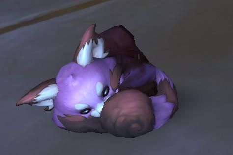 a screenshot from world of warcraft of the new twitch battle pet drop, the shadefur brewthief. they are small, round, and are colored pinkish-purple with brown patches of fur on their arms, feet and tail. the ears are fluffy and white. they also have a yellow bandana around their neck and are carrying a tiny brown backpack.
