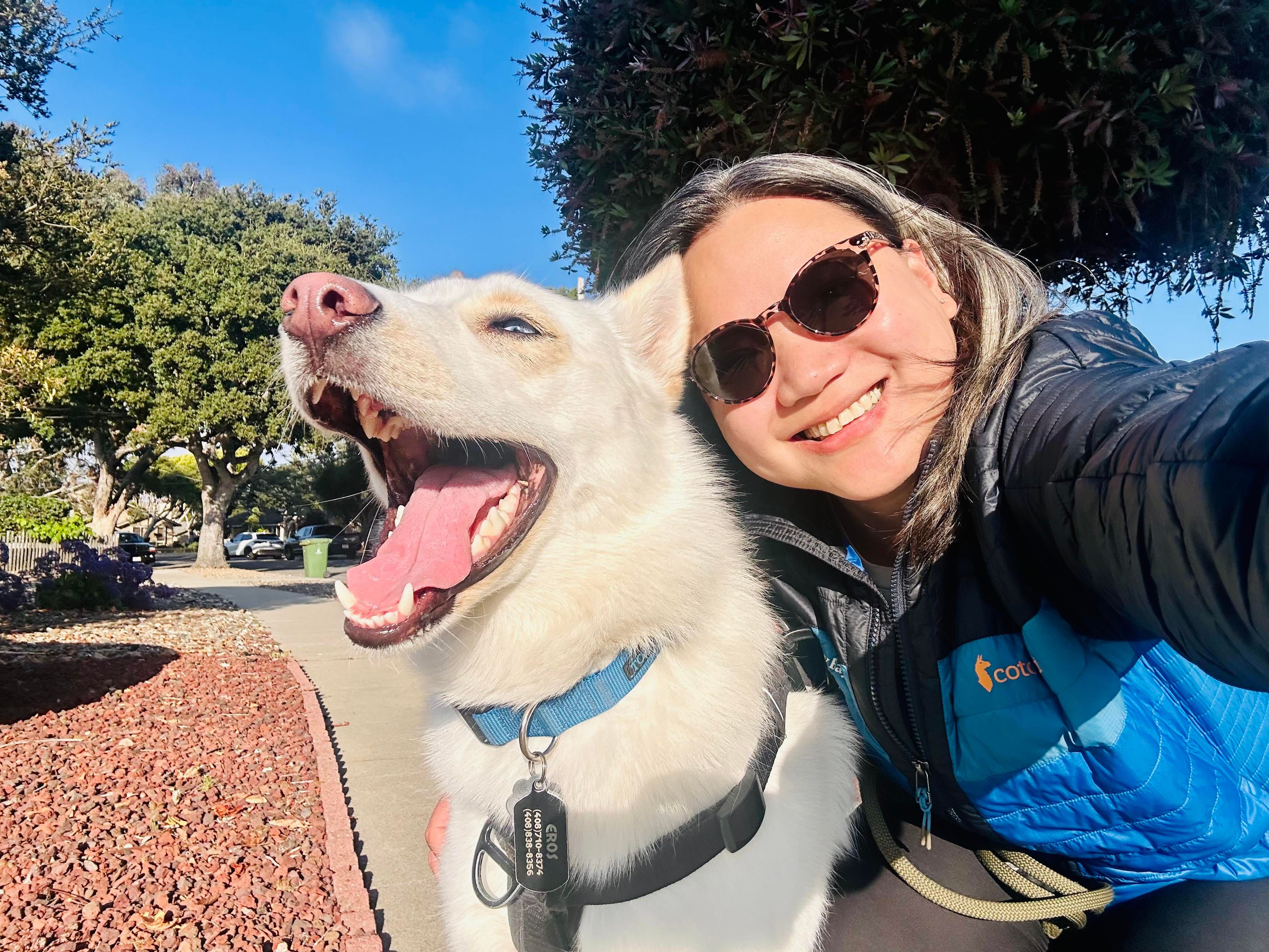 Selfie with a cute white husky mix dog
