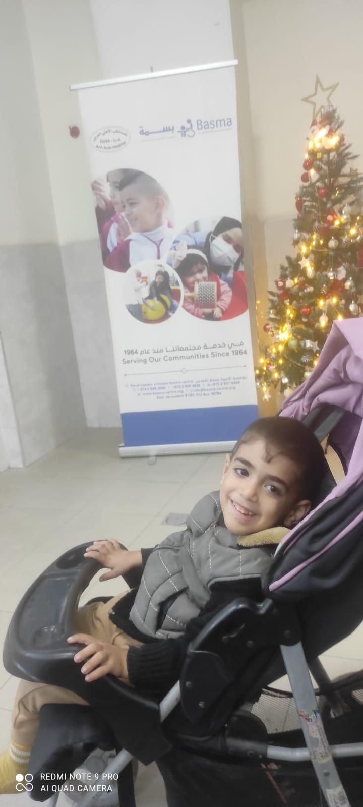 Walid smiles while waiting for his therapy sessions at Princess Basma Center for the Rehabilitation of Children with Disabilities.