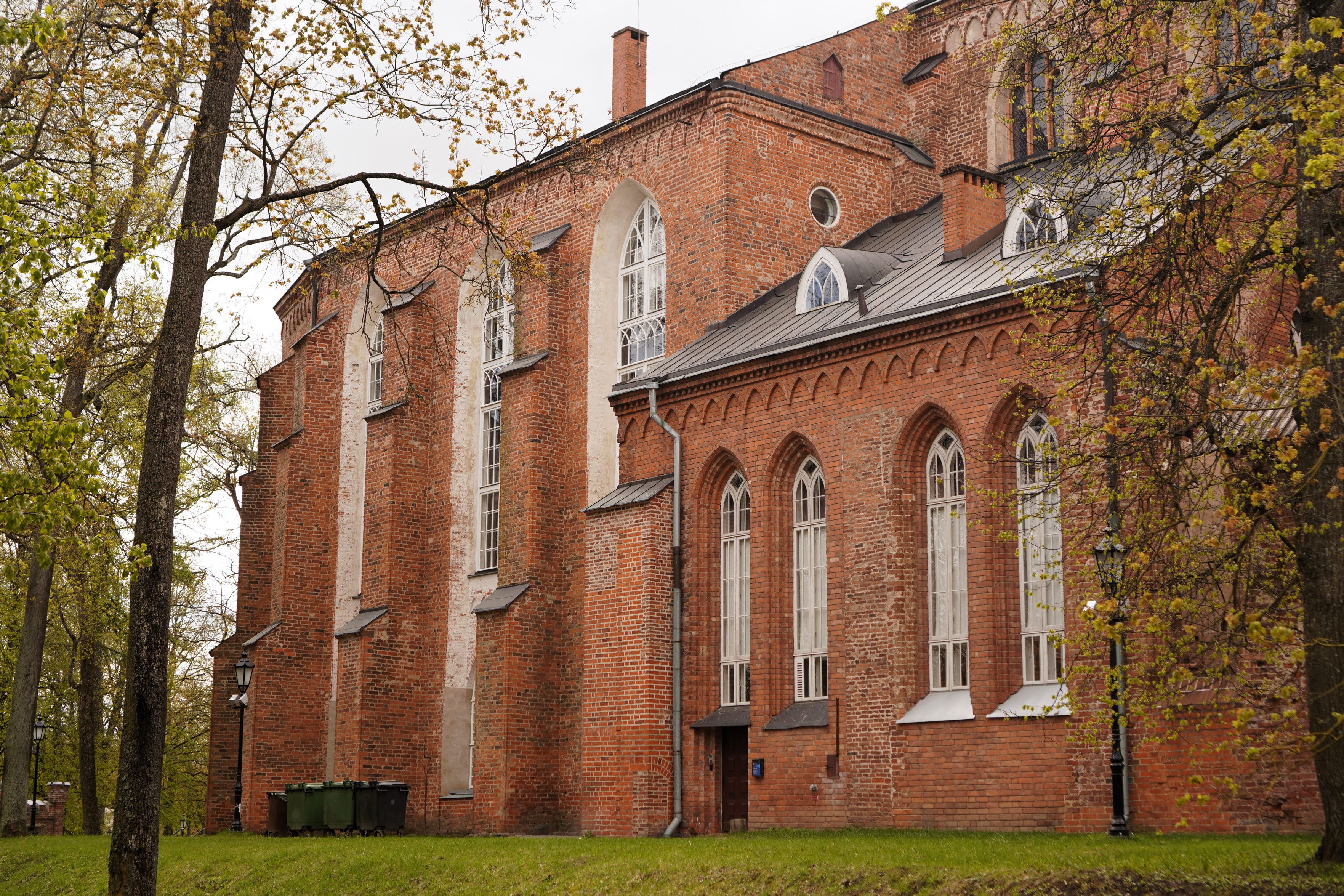 At least one part of the building still is a proper building, though. An old yet renovated looking red brick building with windows and roofs.