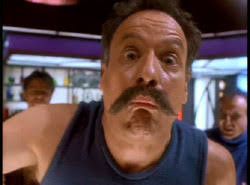 Close up of Q getting punched out by Sisko