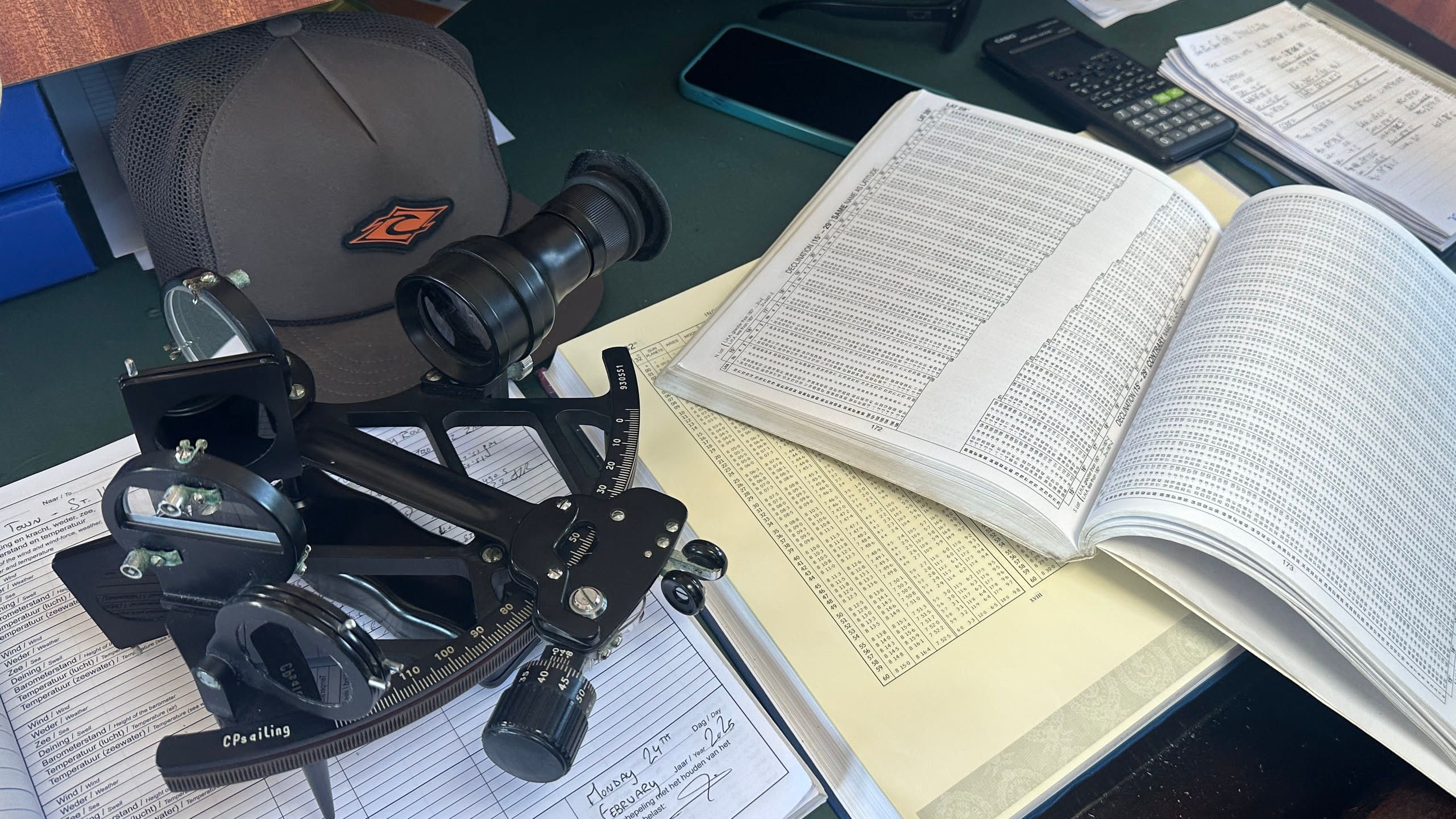 one of the slides with a sextant, almanac and math done in longhand