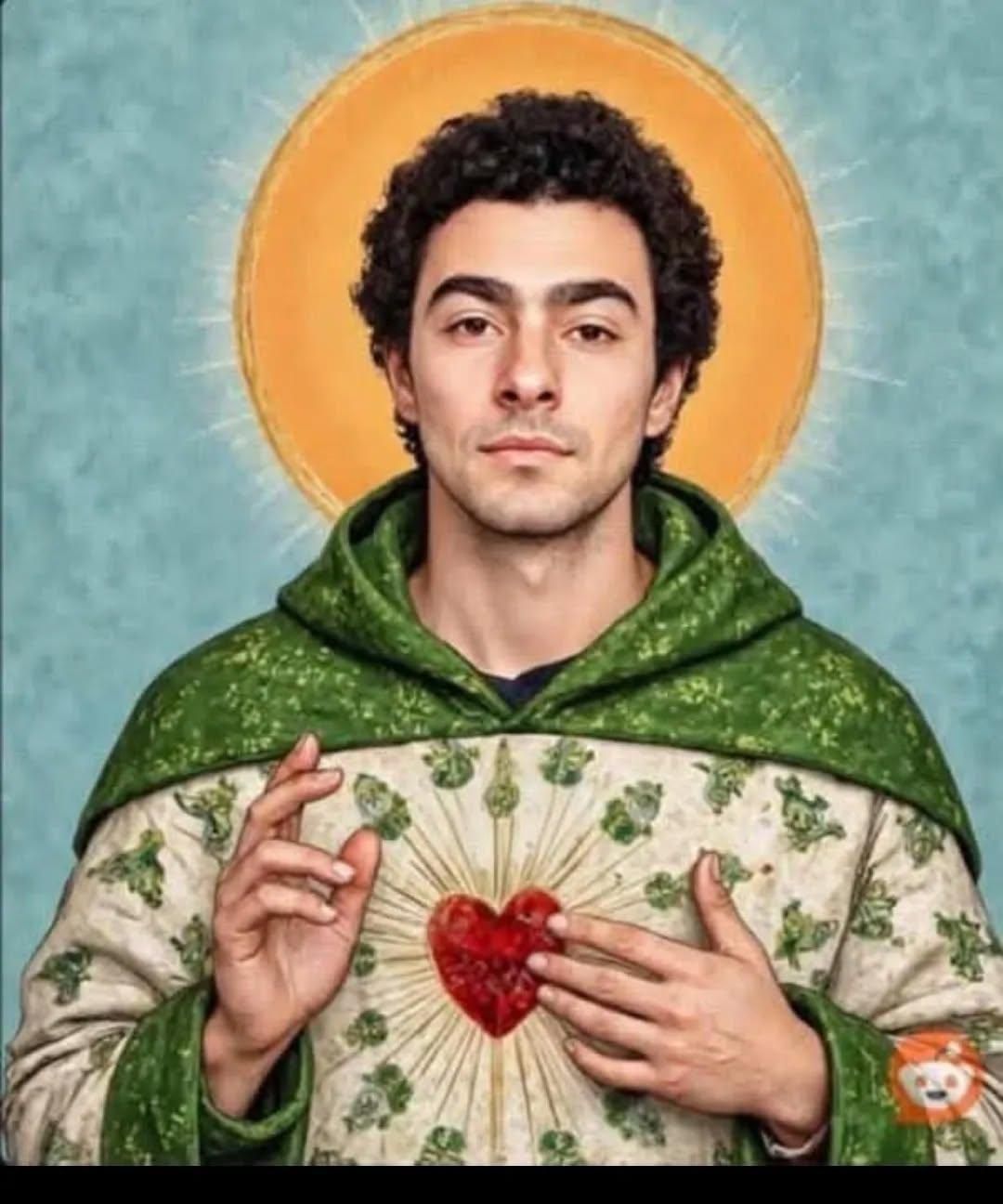 Illustration, or Photoshop, of a white male with black hair (Luigi Mangone) with a golden halo and something a munk would wear with a heart on the front of it.