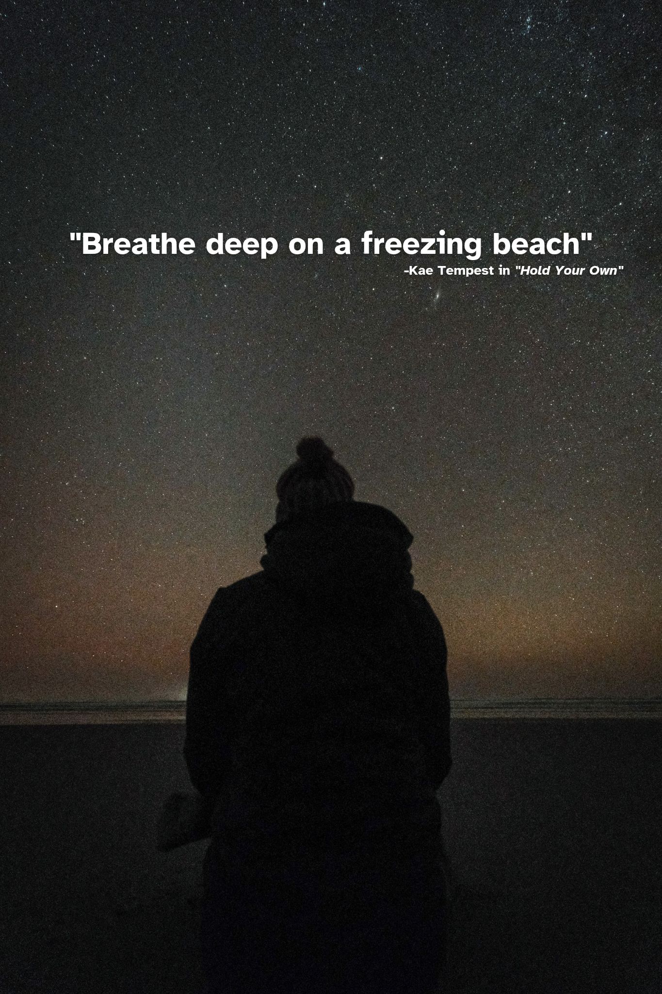 author sitting on a literally frozen beach with stars above and the words "Breathe deep on a freezing beach" from Kae Tempest's spoken word poem "Hold Your Own"