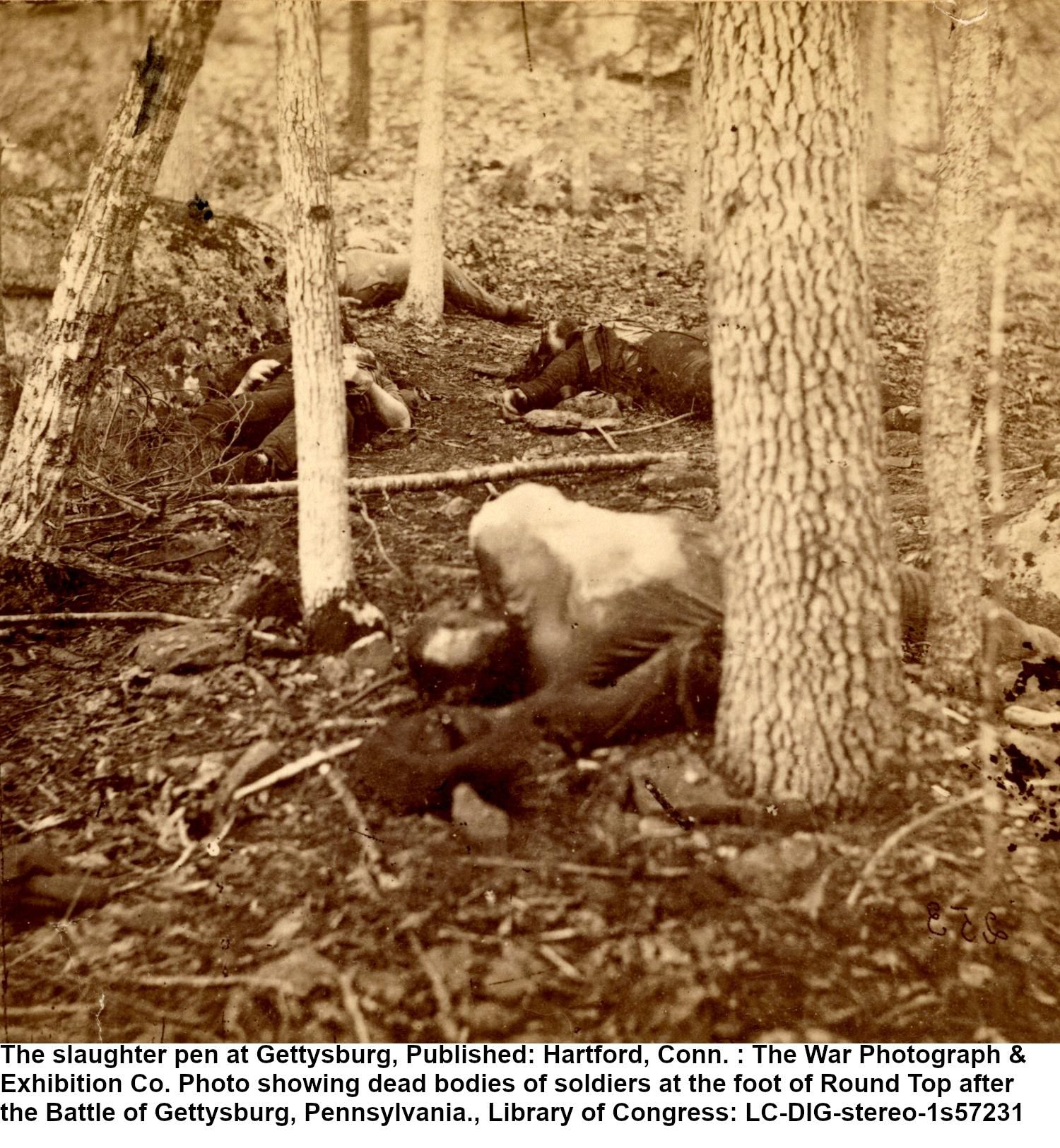 The slaughter pen at Gettysburg, Published: Hartford, Conn. : The War Photograph & Exhibition Co. Photo showing dead bodies of soldiers at the foot of Round Top after the Battle of Gettysburg, Pennsylvania., Library of Congress: LC-DIG-stereo-1s57231