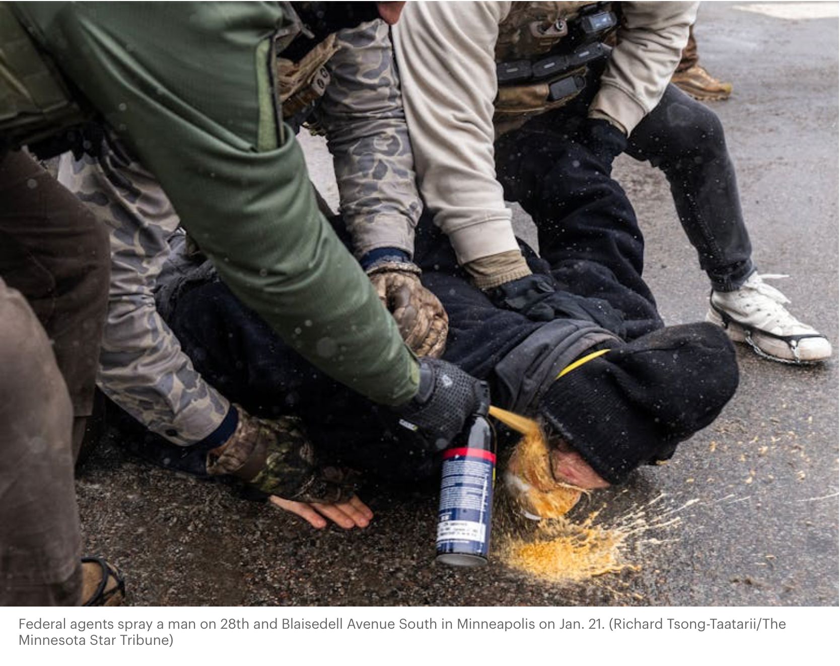 Federal agents appear to be pepper spraying a protester in the face WHILE three agents are holding him down on the ground.