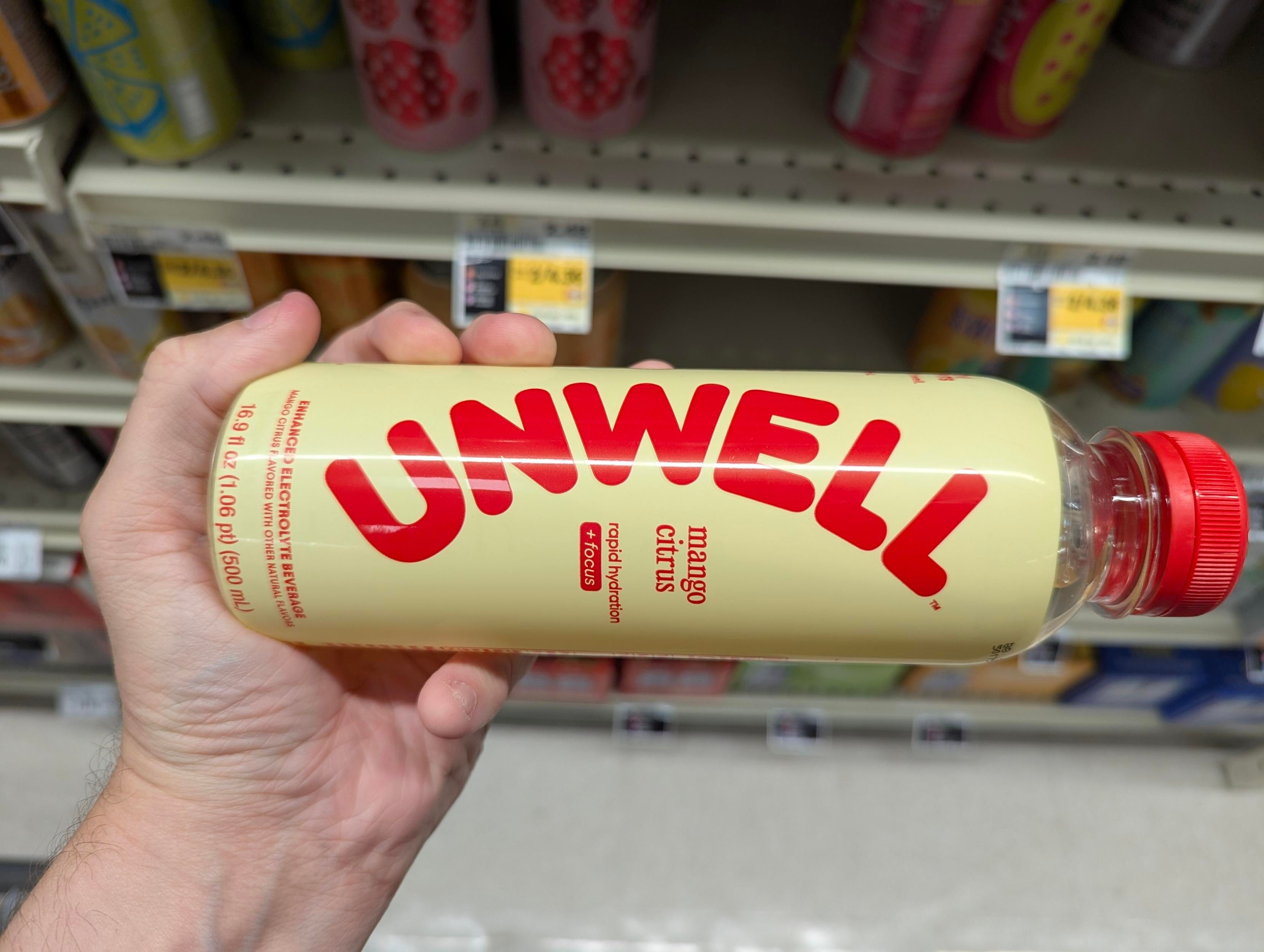 A bottle of flavored water called "UNWELL" 