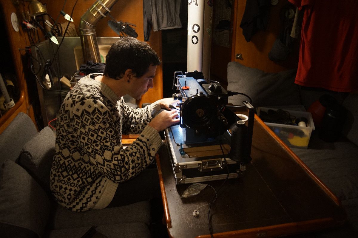 Devine is hard at work on our sewing machine.