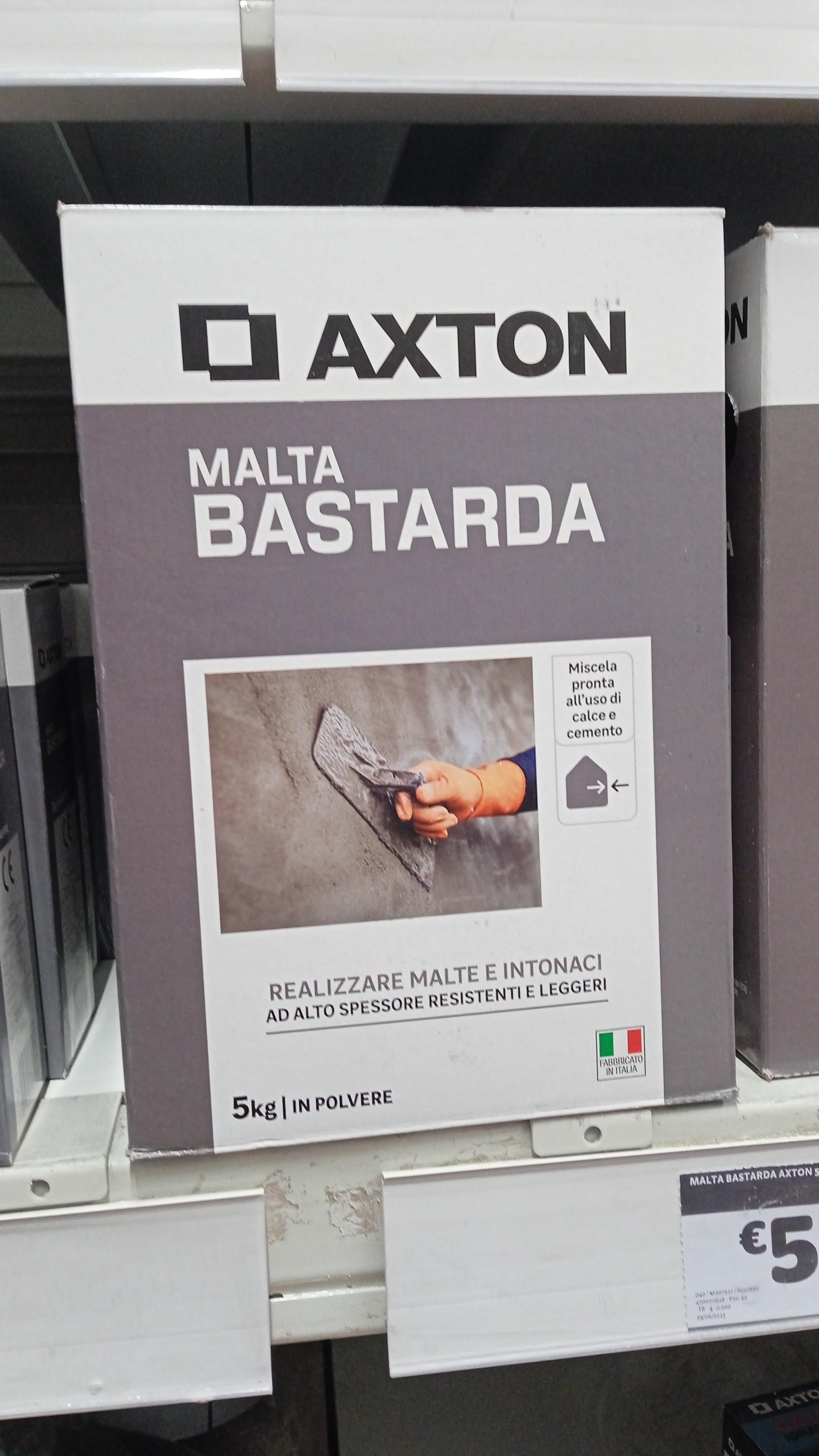 A grey and white cardboard box containing bastard mortar on a shelf in a store.