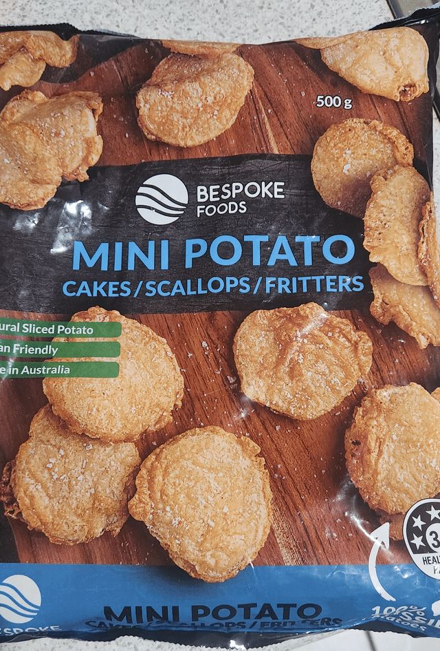 A photo of a frozen food packet which reads "Mini potato cakes/scallops/fritters".

These are three different regional names for slices of potato that have been battered and fried. Arguing about the "true" name for this food is a popular Australian pastime.
