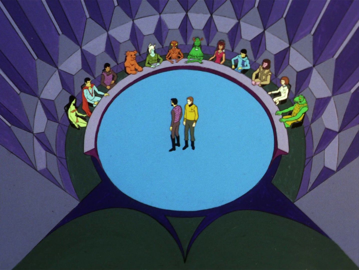 Captain Kirk and Klingon Captain Kor face the descendants of trapped aliens how have learned to live in peace. They stand on a blue circular floor facing a semi circle table where 12 different species representatives are seated.