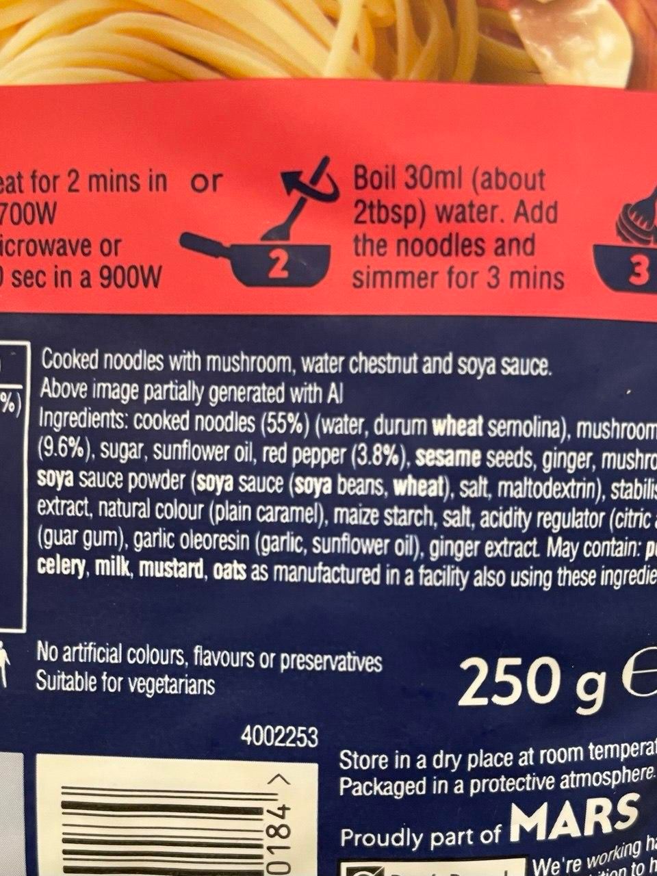 A photo of a pack of ready made noodles made by Mars. The label says that it is cooked noodles with mushroom, it is suitable for vegetarians, and that the image of the food on the pack is "partially generated with AI"