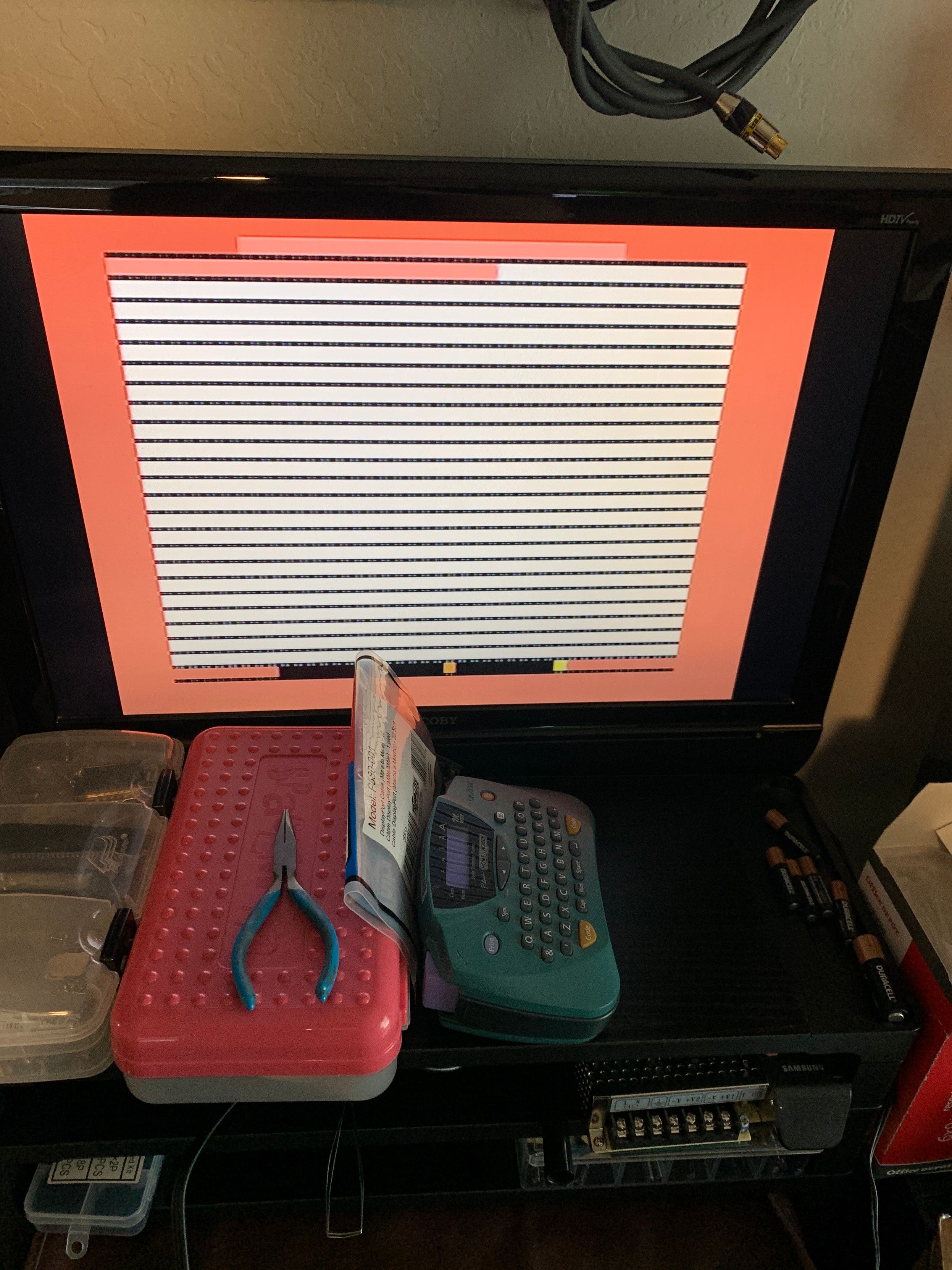 Output from the failed ViC2 through a BackBit cartridge. Red border output with stripes of white.
