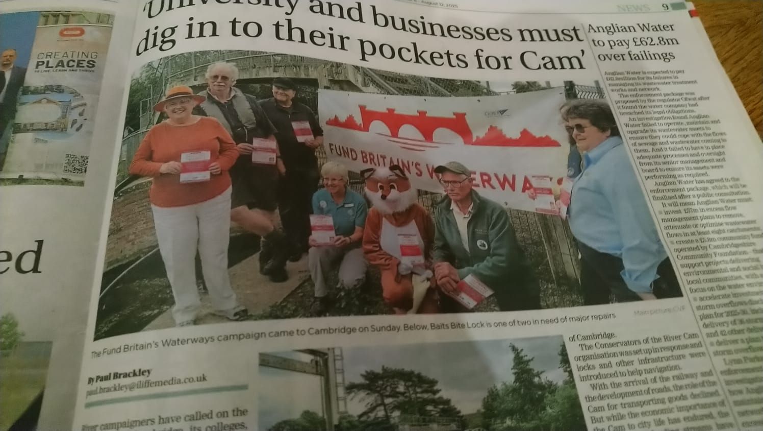 an article in the newspaper of protesters to fund the river cam's waterways with a furry fox in the picture