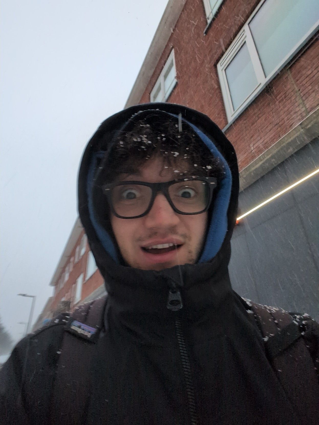 Selfie of me with snow on my hair.