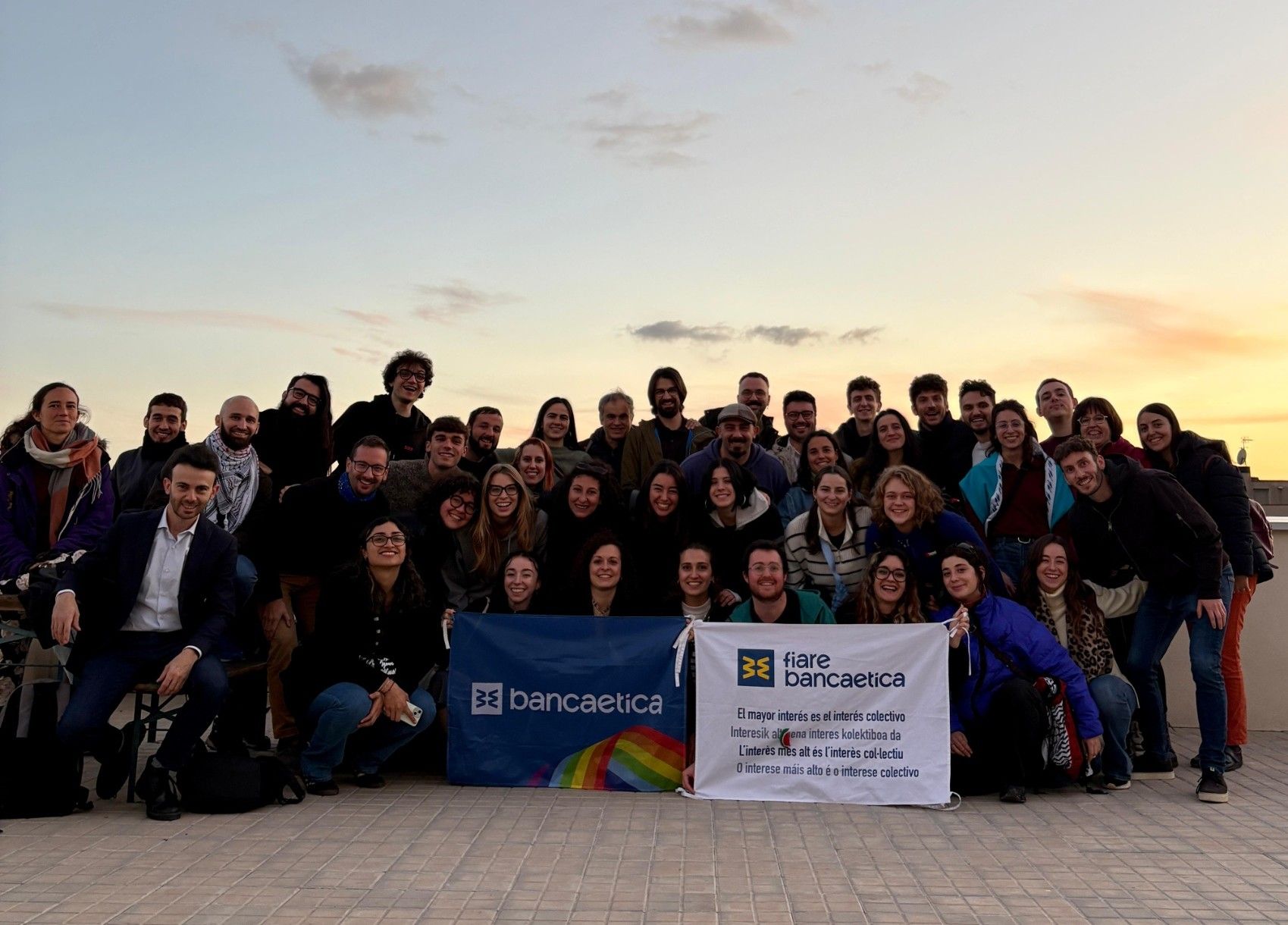 Group picture with Banca Etica flags