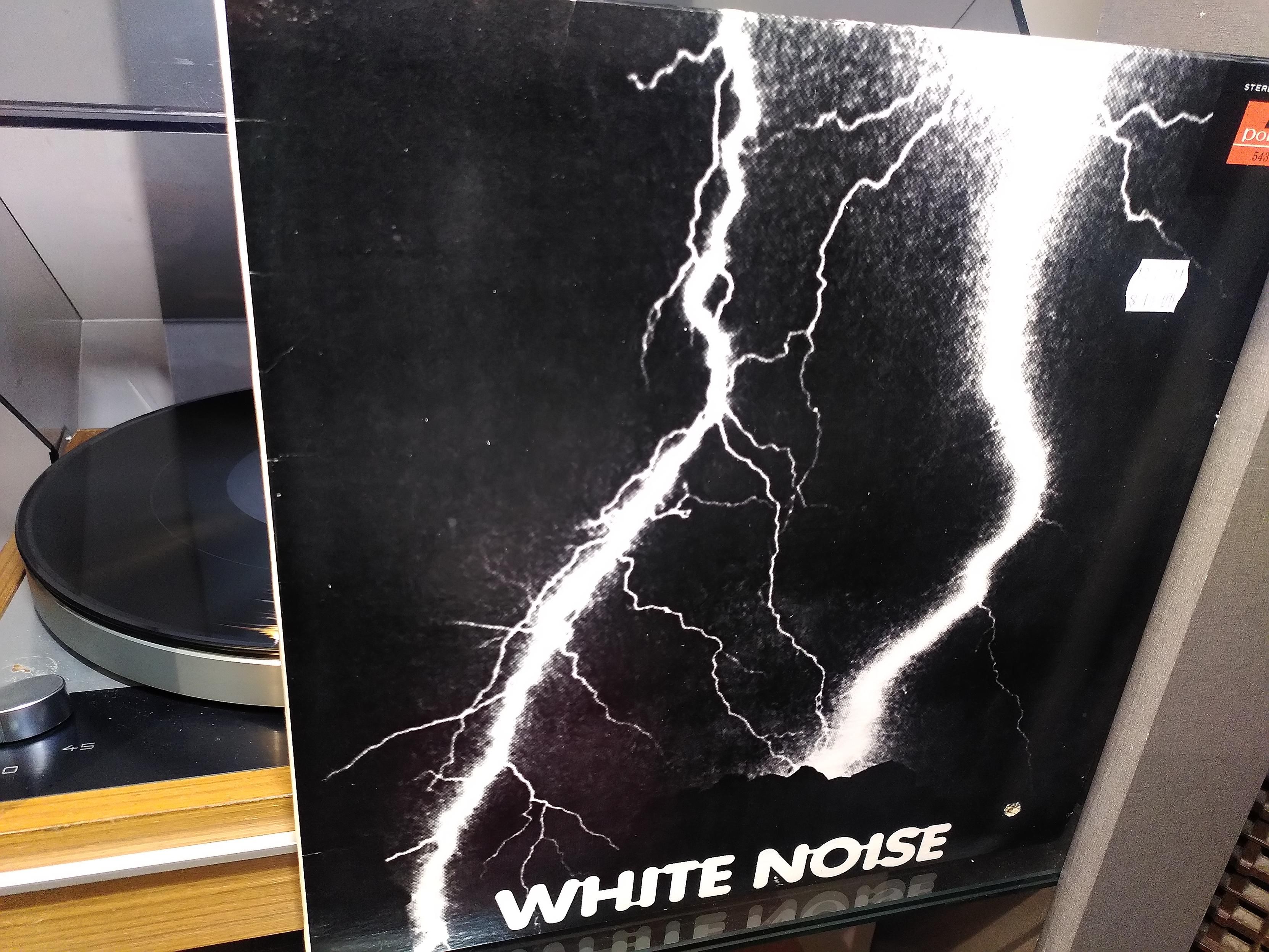 White Noise 'An Electric Storm' LP cover. Black and white photo of two bolts of lightning striking at night