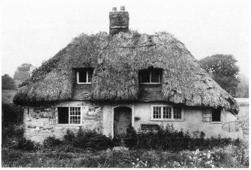 Fourteenth-century peasant house, St. Mary’s Grove cottage, Tilmanstone, Kent. Originally of one storey, the house has retained the studs of the medieval partition that divided it into two rooms, and the framing of the window wall.