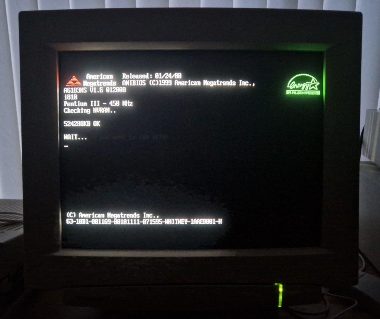 A photo of a CRT showing how a computer boots. It says Pentium III 450 MHz with 512 MB of RAM