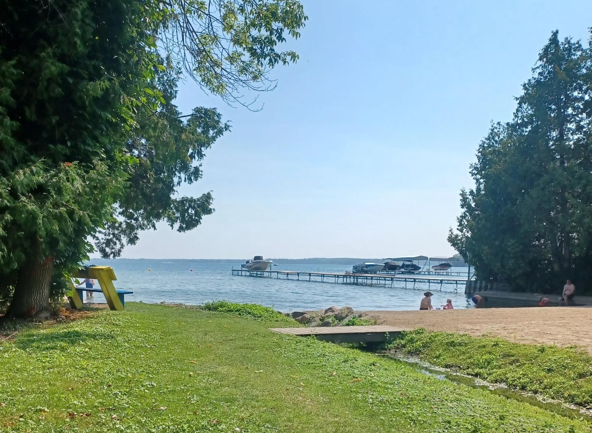A photo of our local beach in Belle Ewart Ontario.  Called Belle Aire Beach, it is located between private homes on either side and is approximately 50 metres wide. Two thirds of the shoreline is a sand beach.