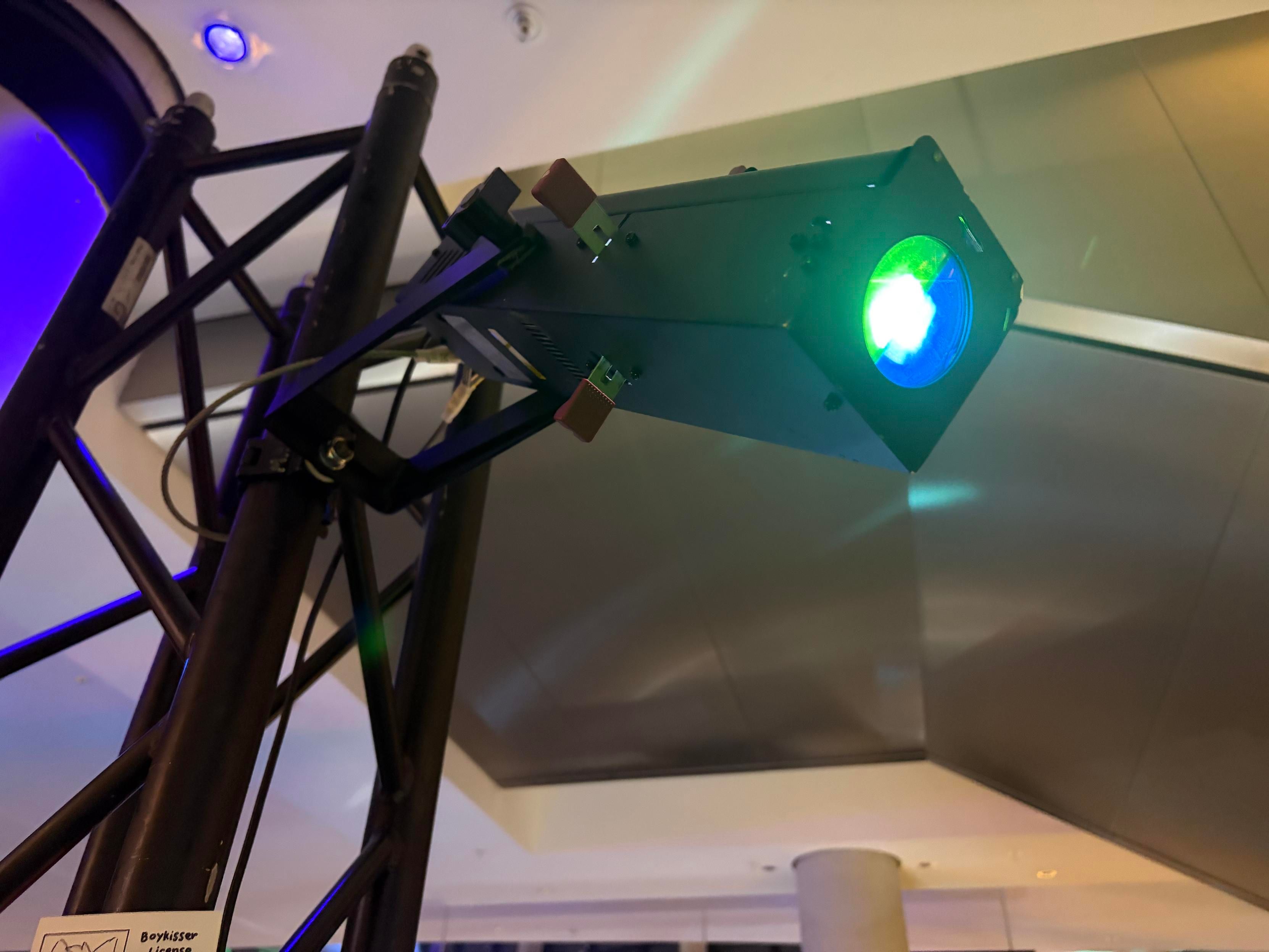 the "boy kisser" emblem in bright blue and green LED light projector