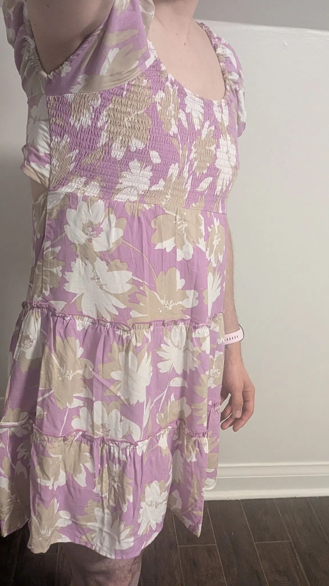 A classic selfie pose, I show off my pink floral dress. 