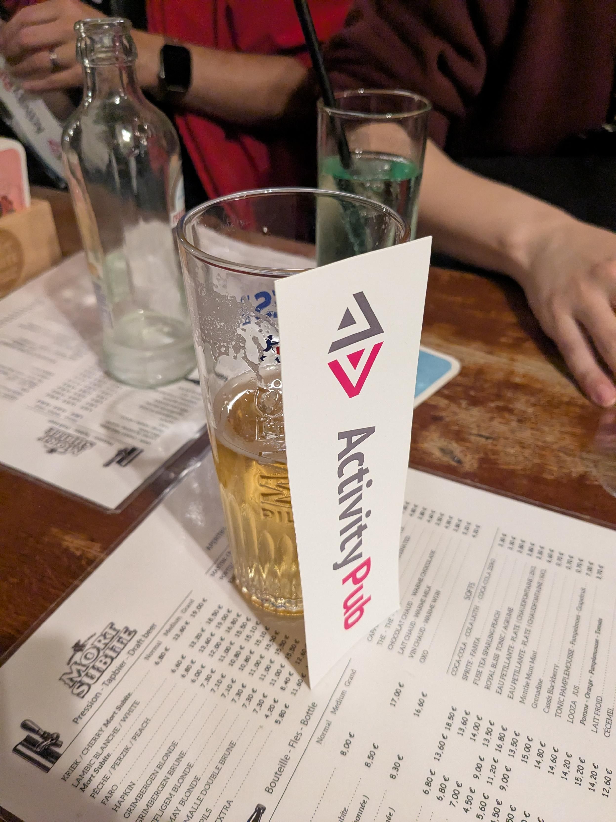 A beer with a ActivityPub sticker leaning on it 