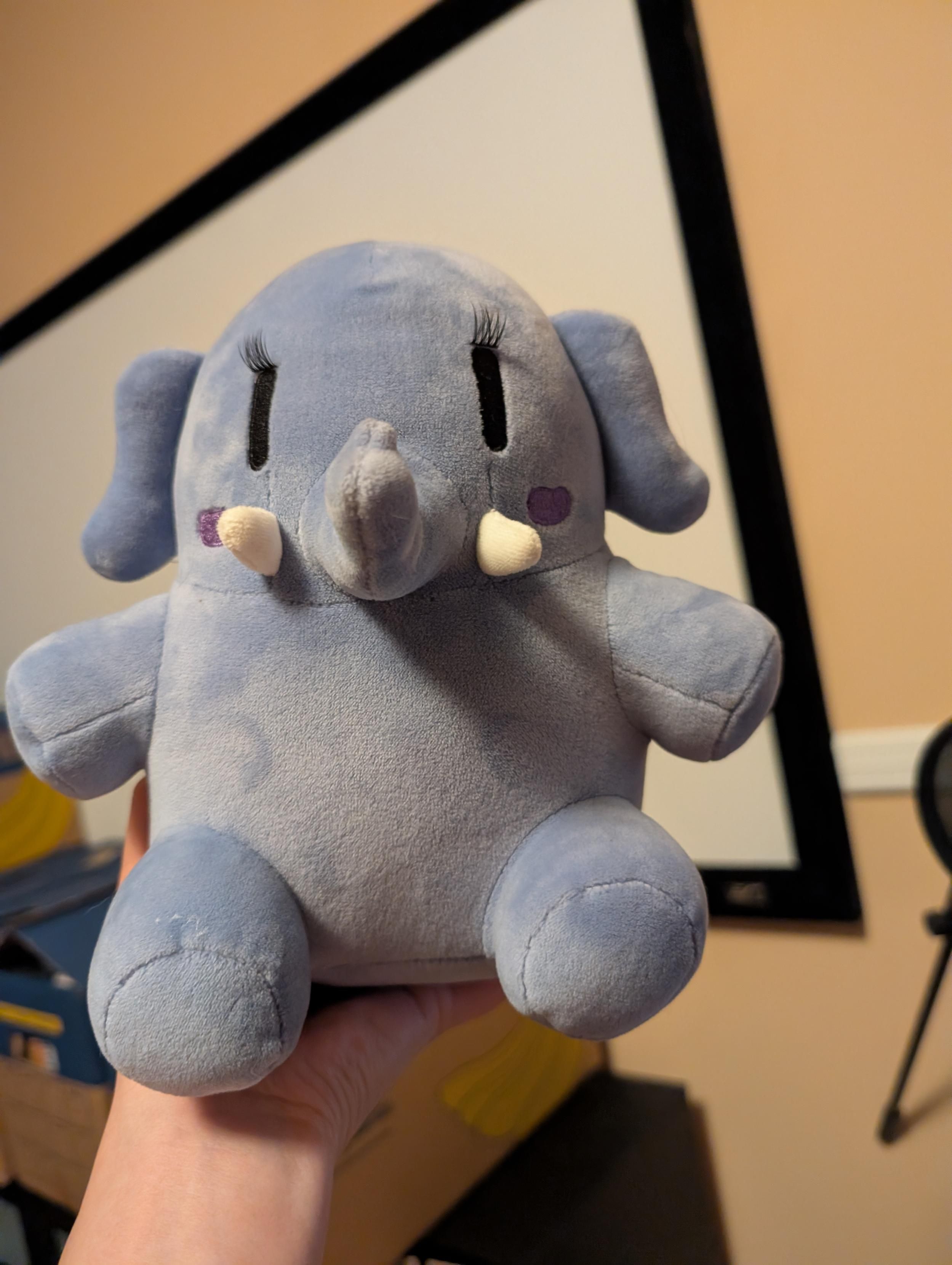 The blue Plushtodon with eyelashes.