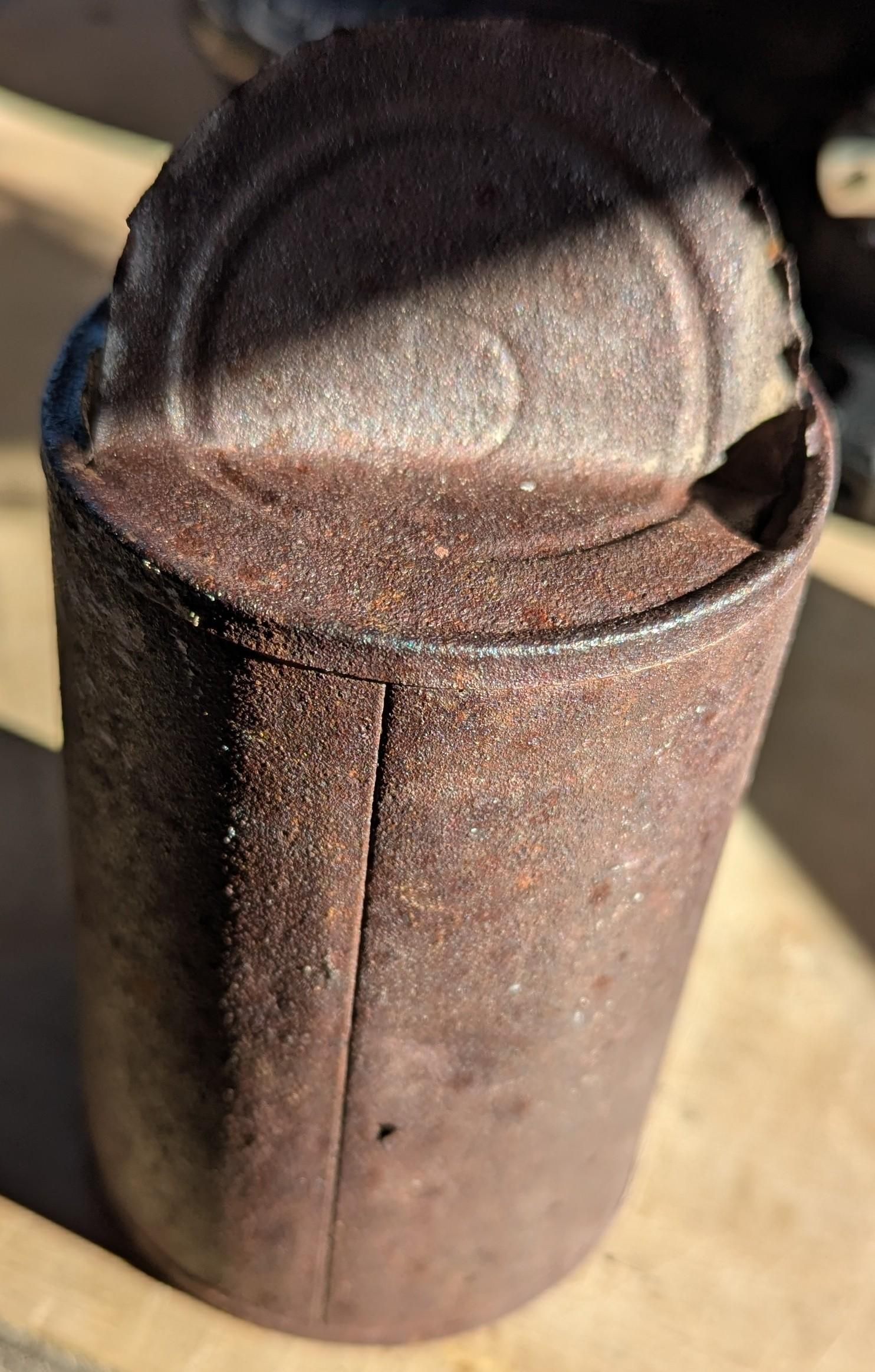 A rusted steel can.