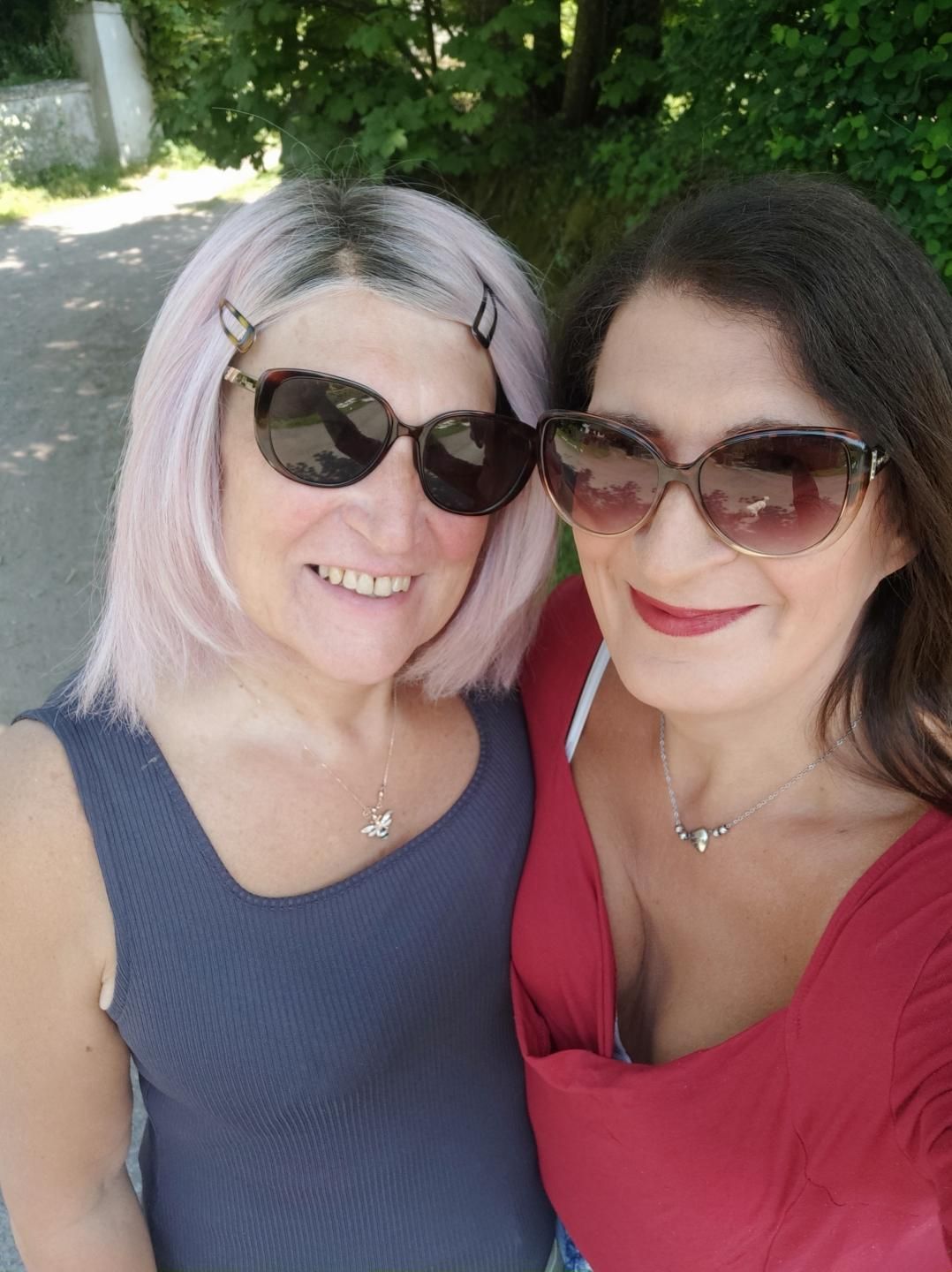 A selfie of two women wearing sunglasses