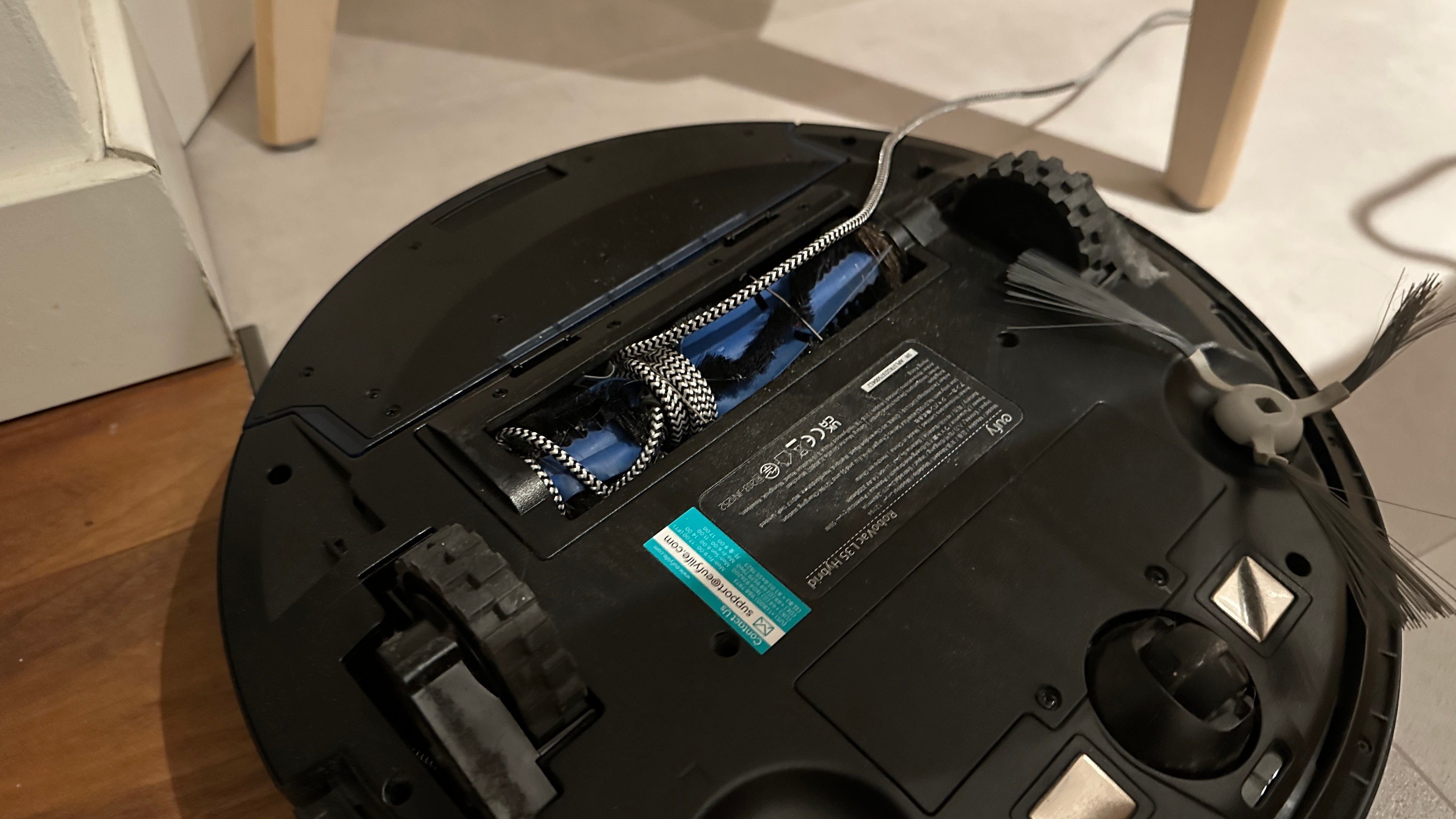 USB cable wrapped around a vacuum cleaners roller