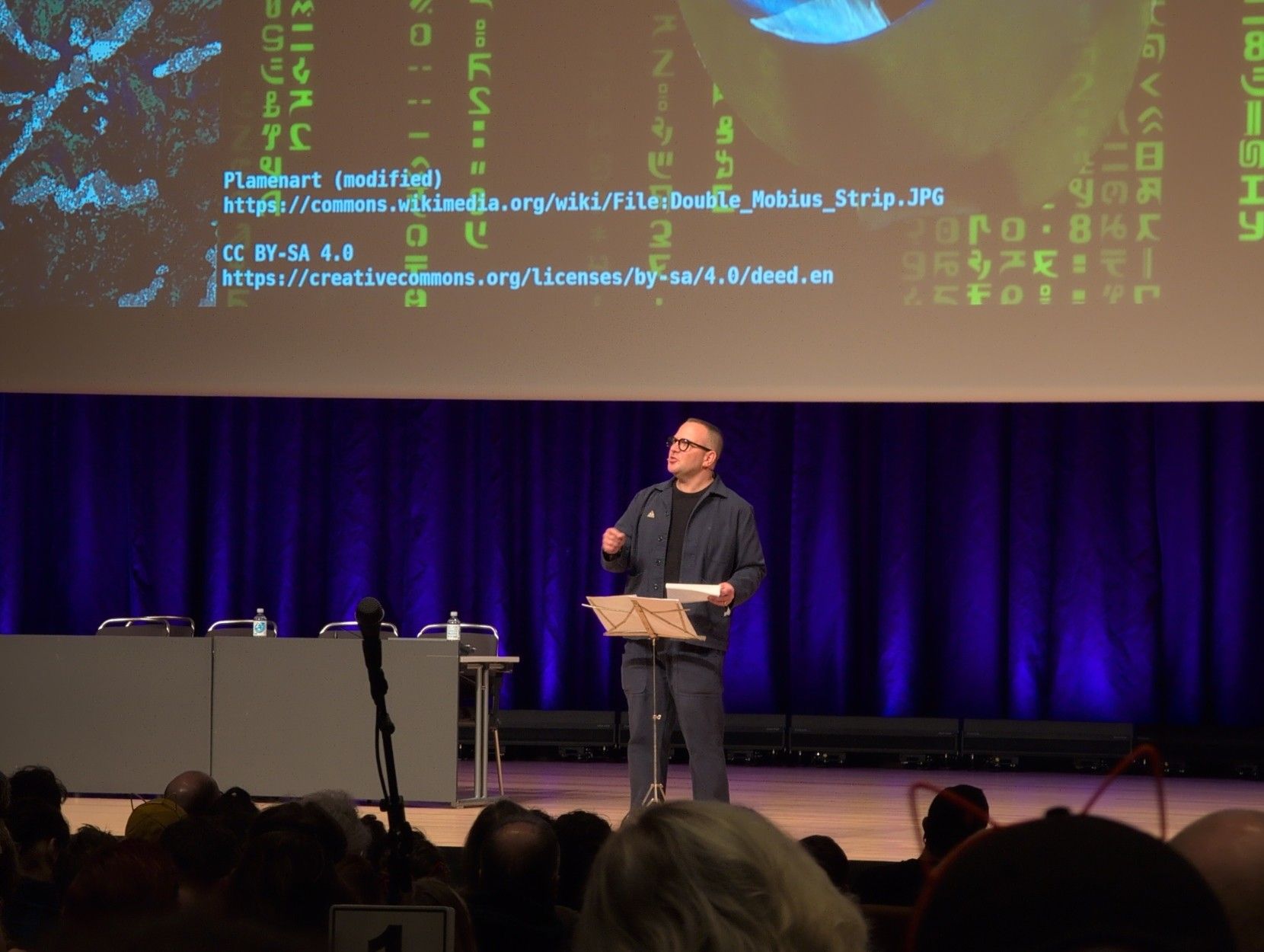 Cory Doctorow speaking on stage