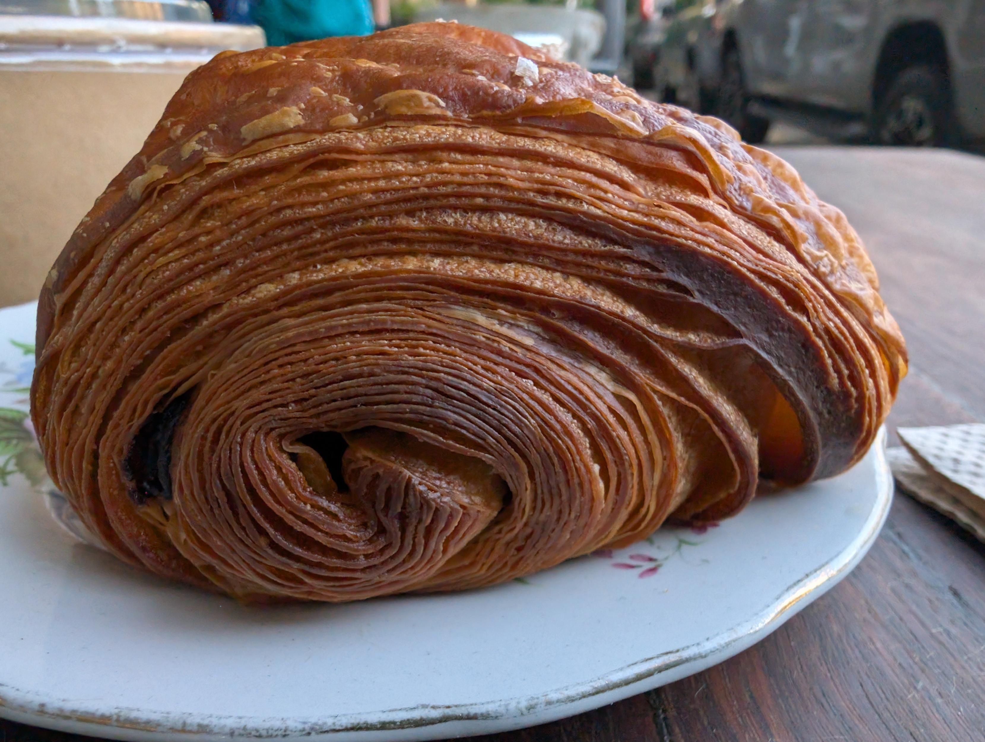 Chocolate croissant ends with hundreds of layers
