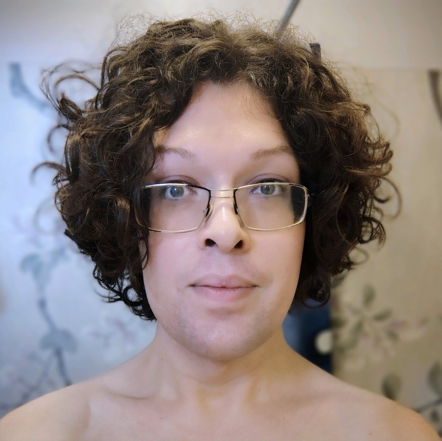 selfie without makeup and with a visible facial hair shadow. wearing my crappy old worn out glasses. smiling!